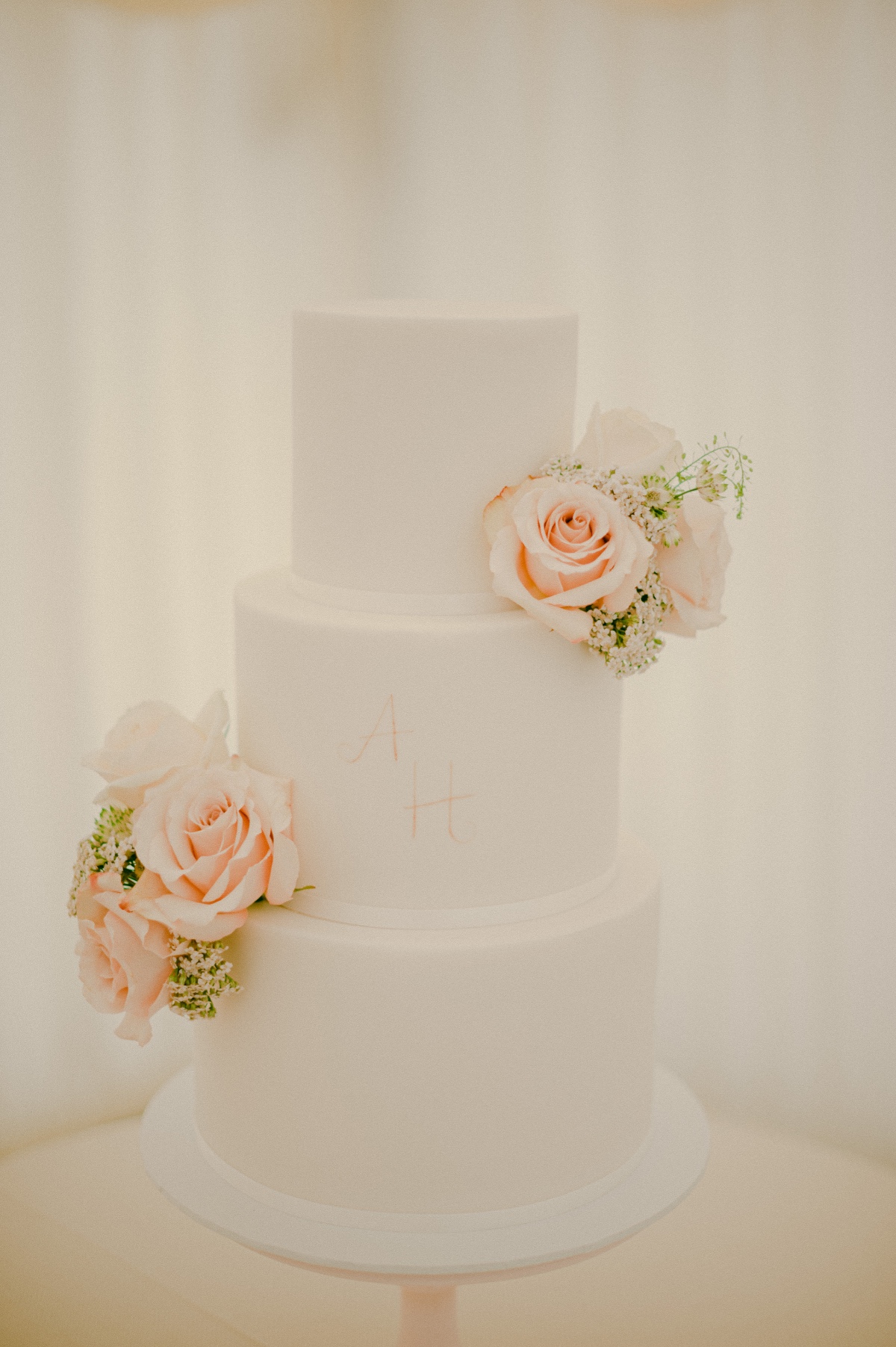 Dotty Rose wedding cake adorned with florals