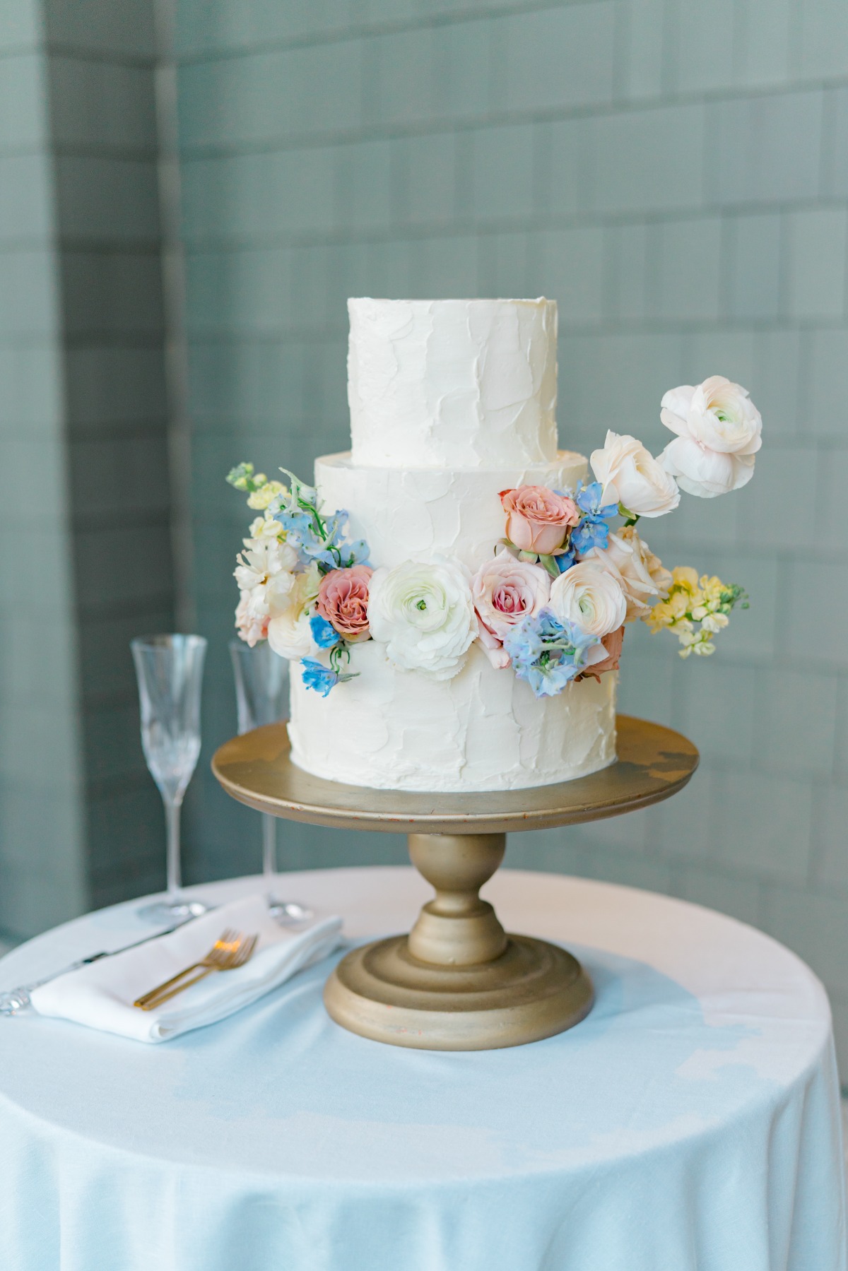 3-tier wedding cake with fresh flowers