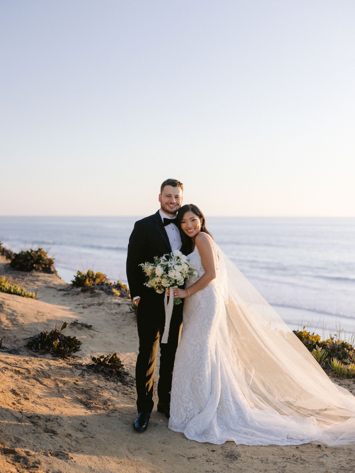 Sunset ocean portraits with bride & groom