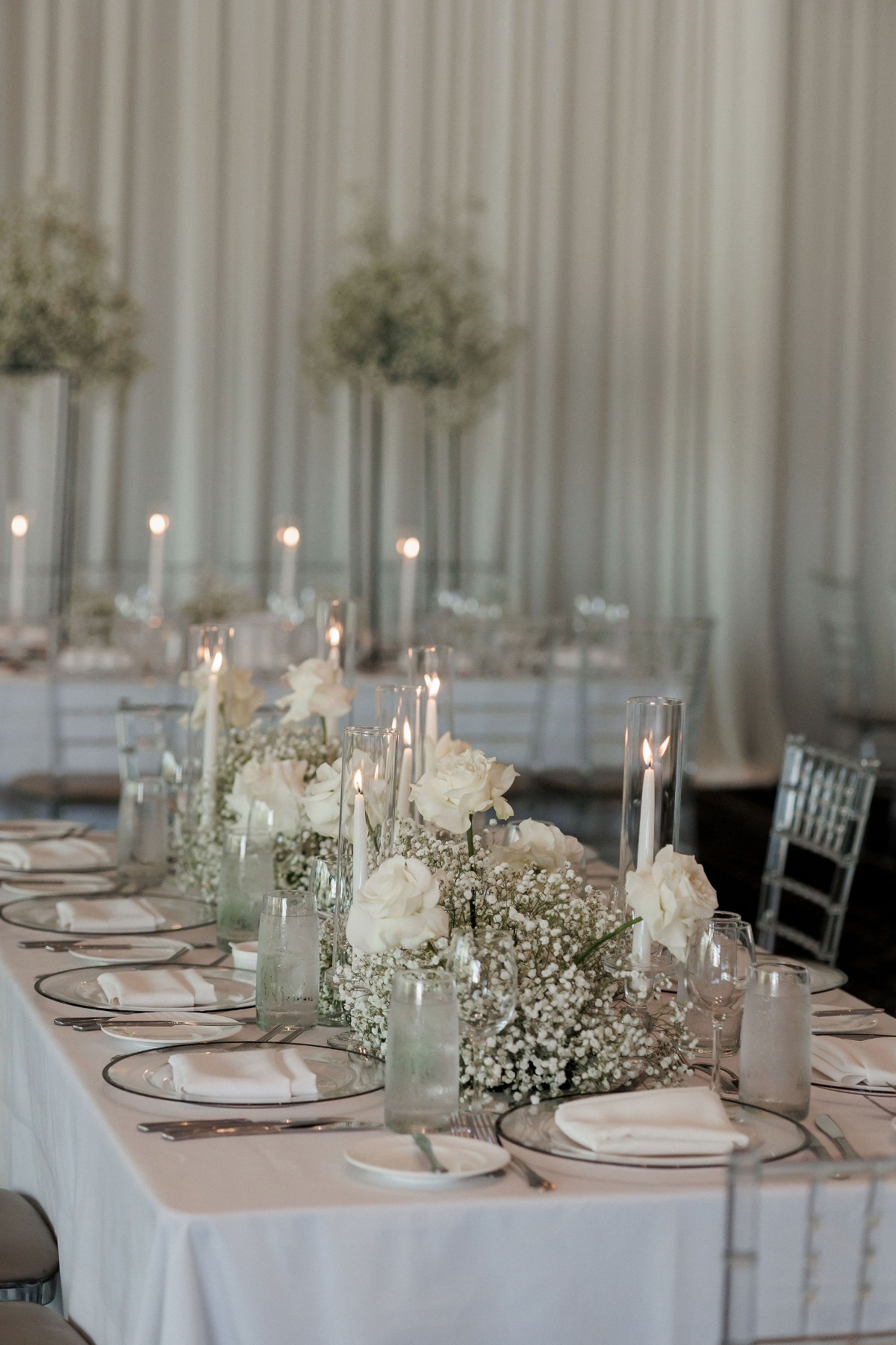 baby's breath and white rose arrangements