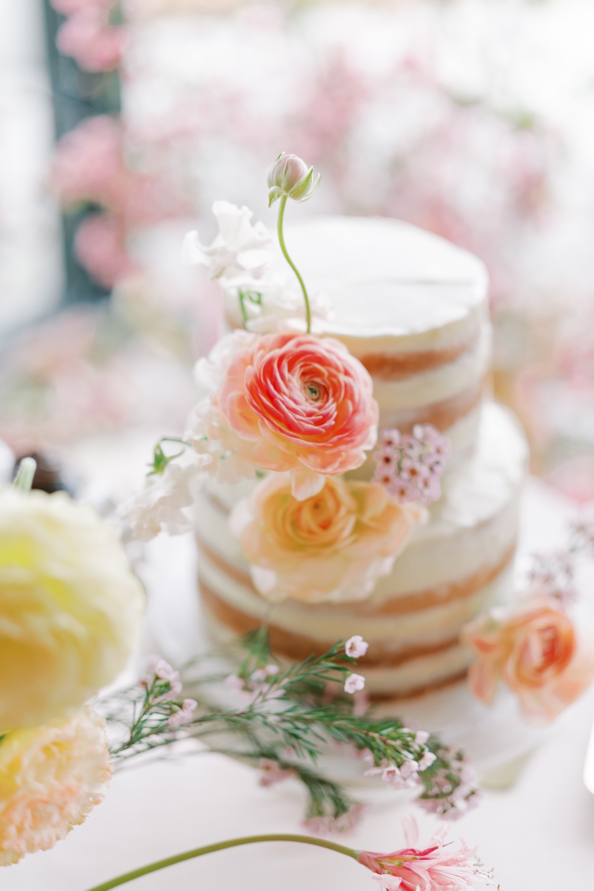 wedding cake with fresh summer flowers