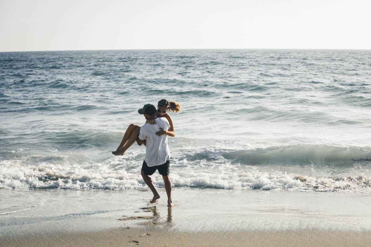 Couple running on beach