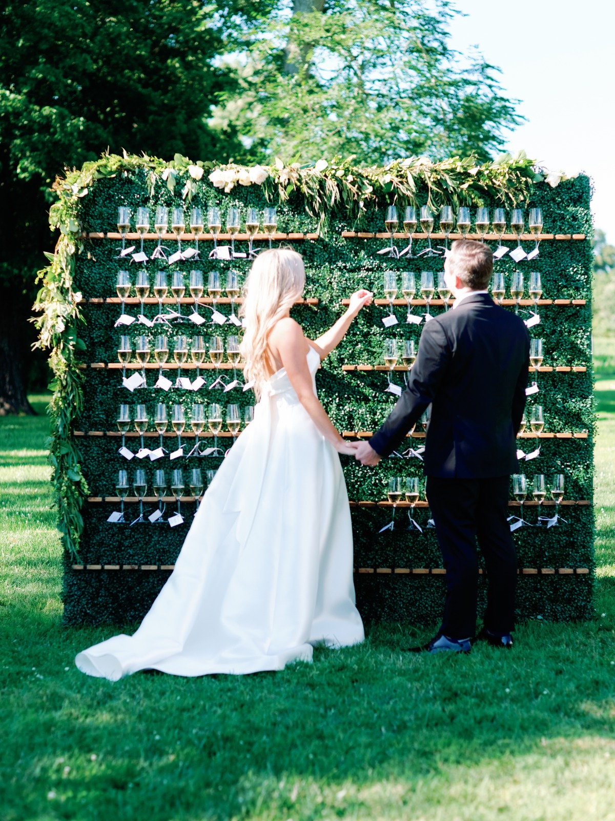 champagne wall with greenery