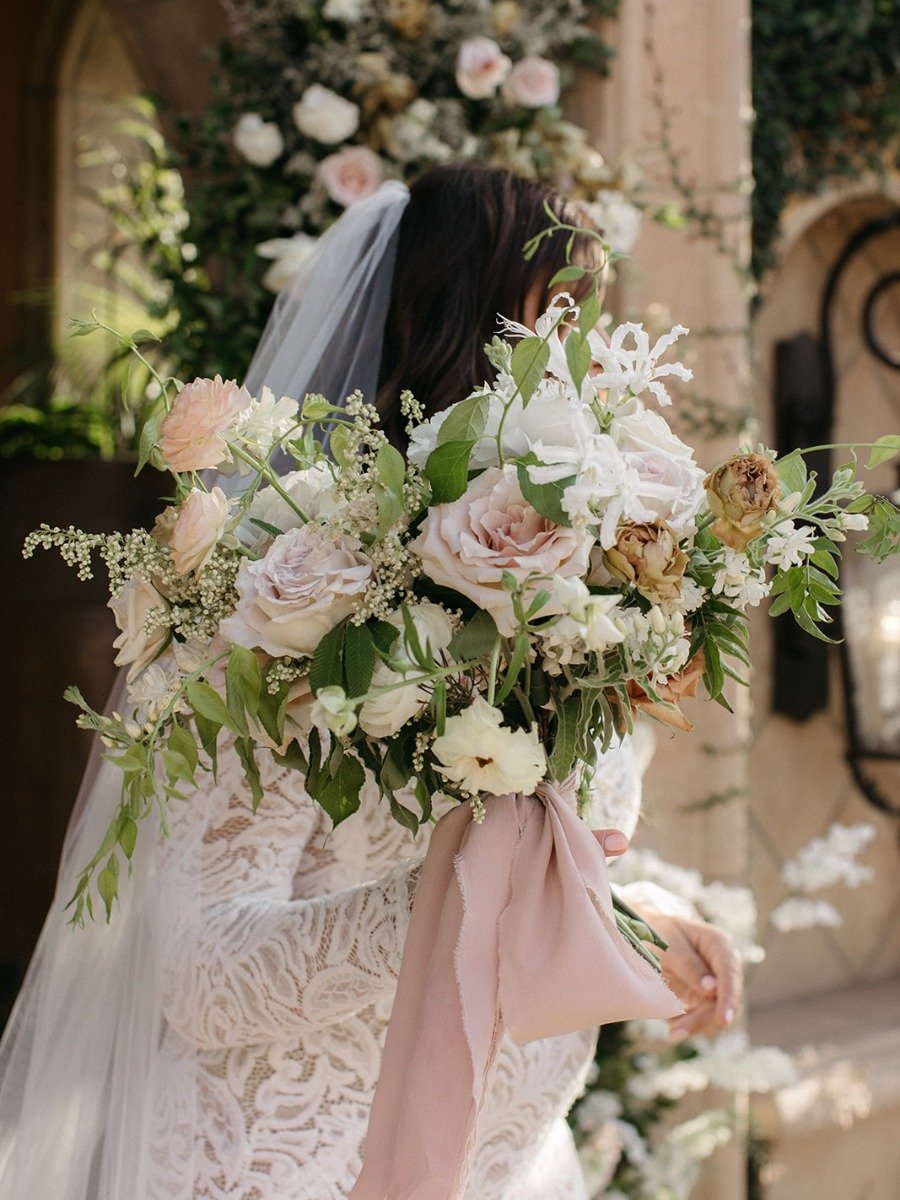 Aisles of blooms transformed this Tuscan-inspired backyard wedding