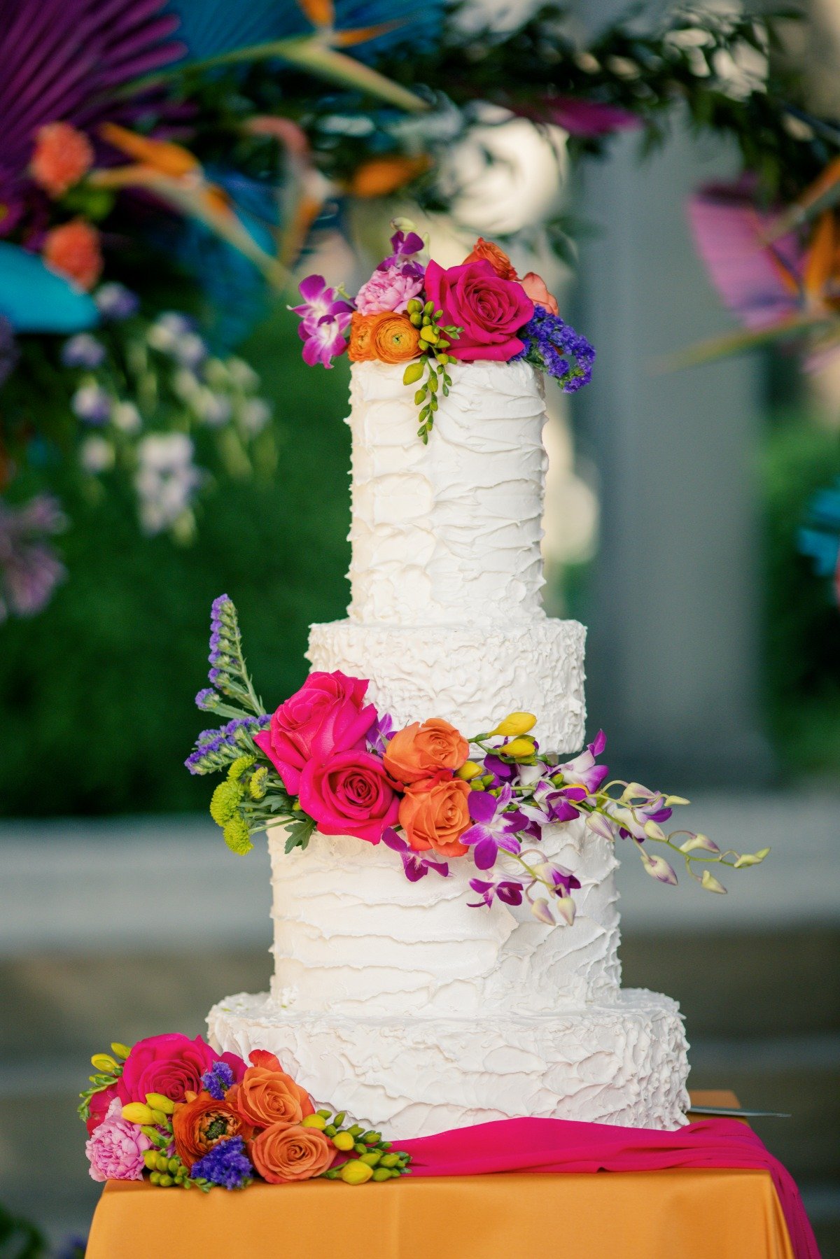 wedding cake with colorful flowers