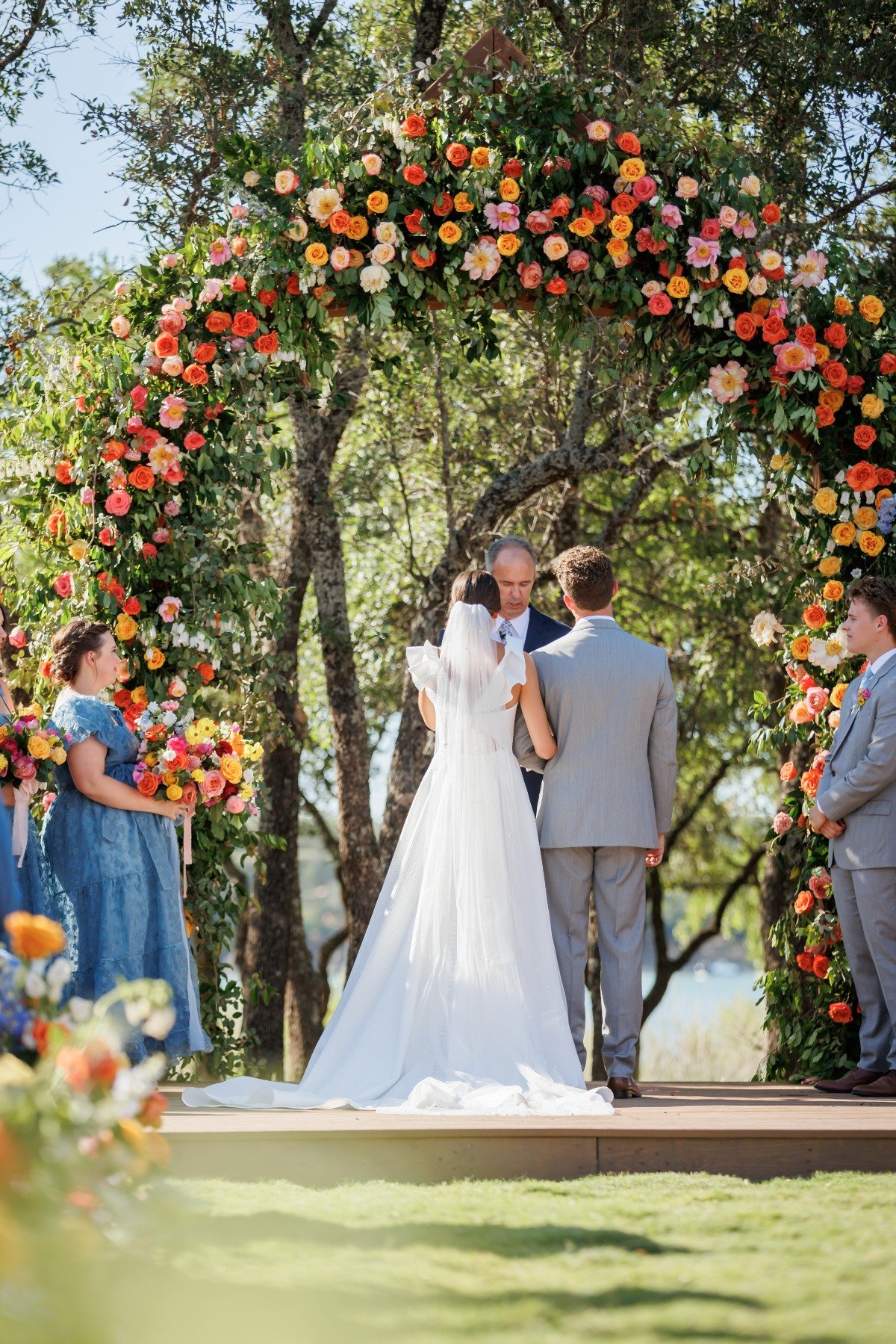 large citrus-inspired floral arch