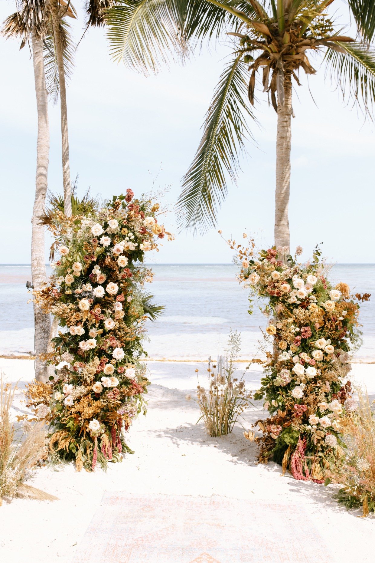 S.O.S. Planners beach wedding in Mexico floral arch