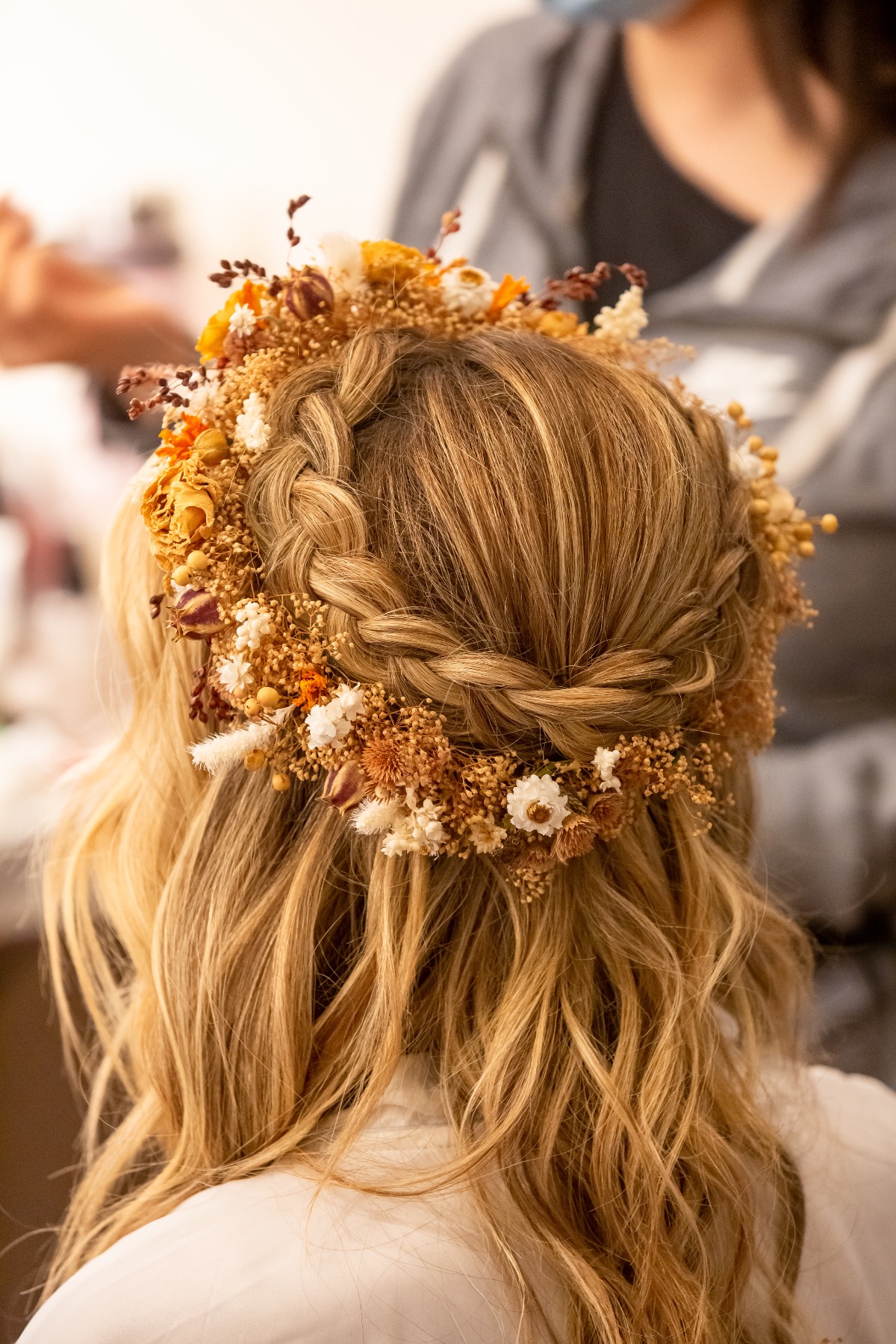 bride with braid crown and flower crown