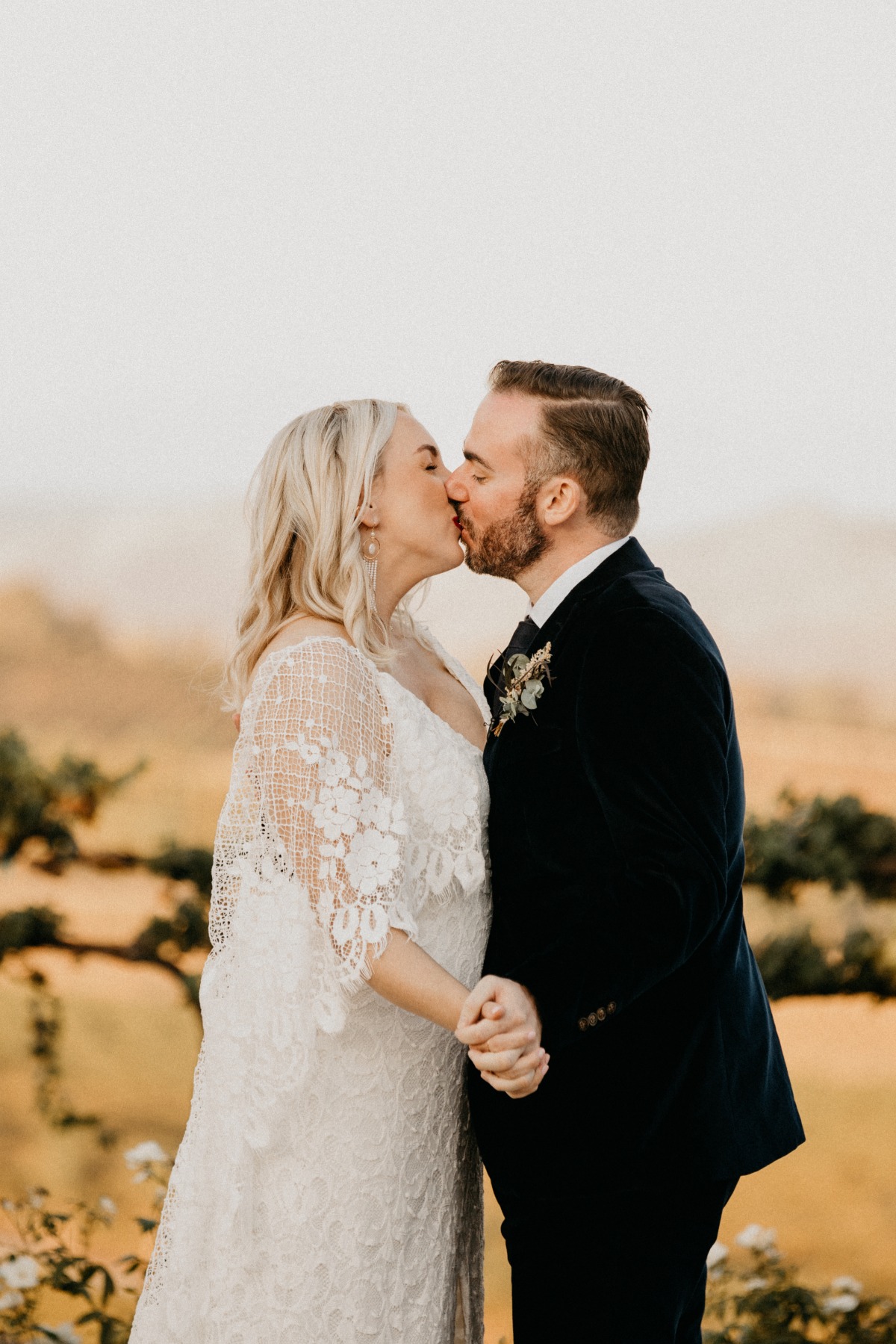 wedding kiss at Mount Palomar winery in San Diego
