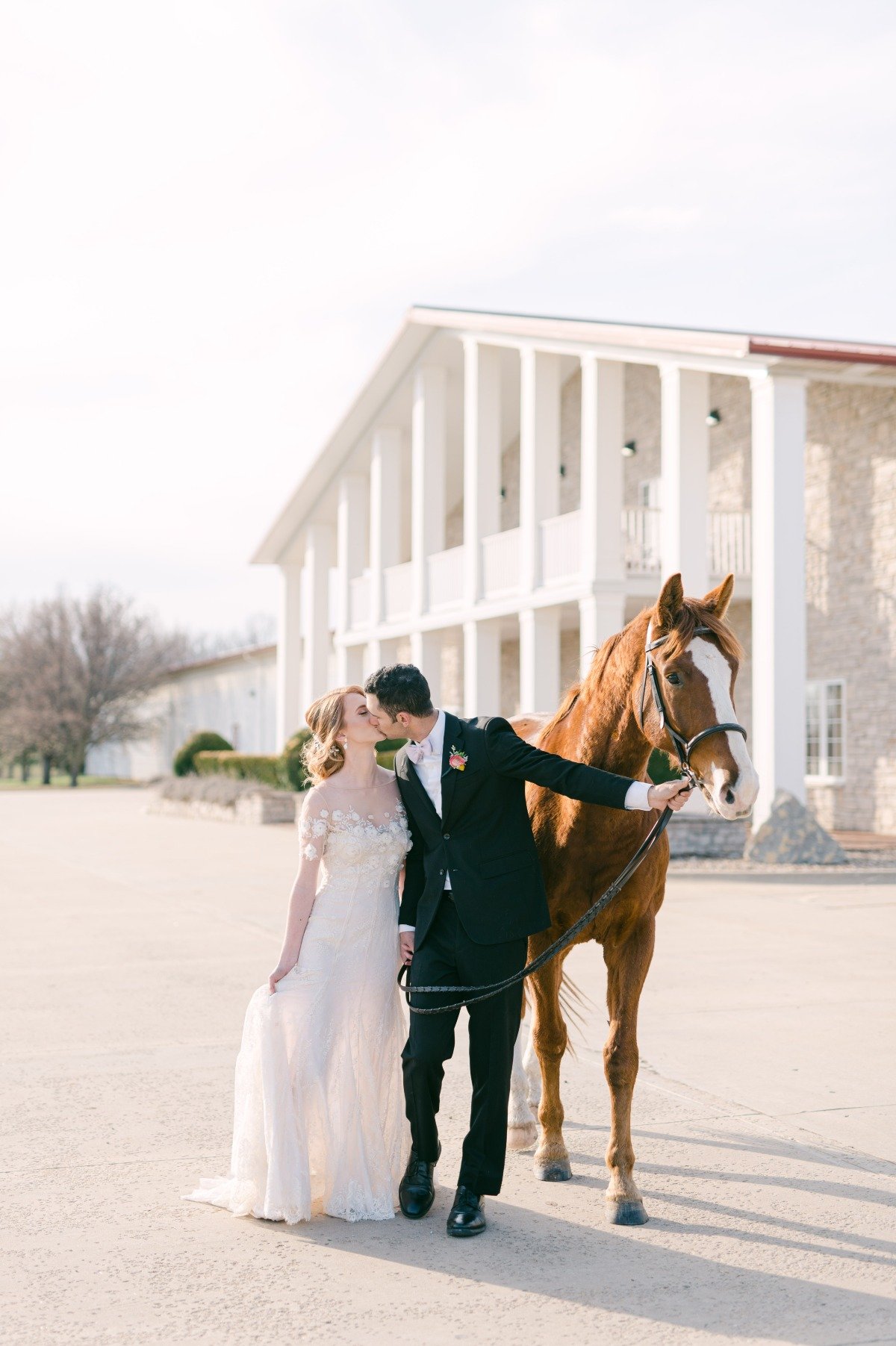 Bride and groom with their horse