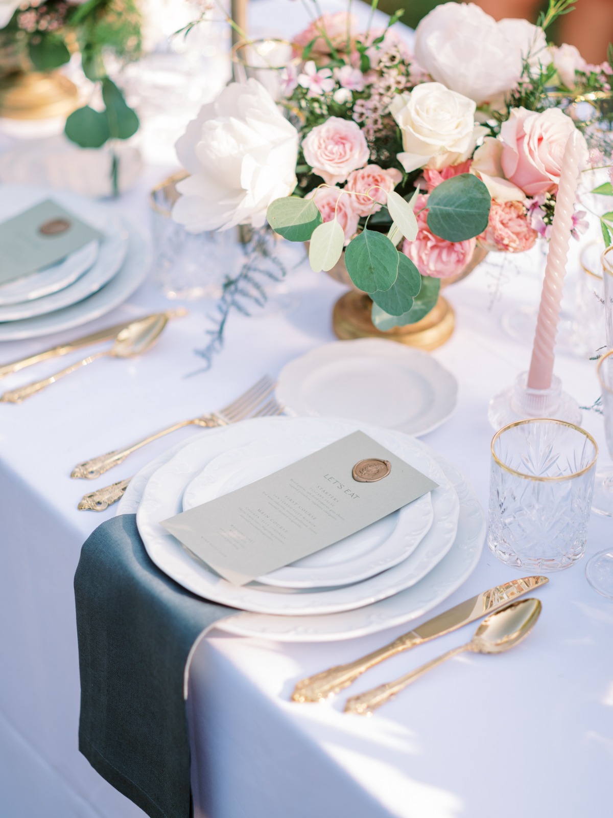 white and gold place settings