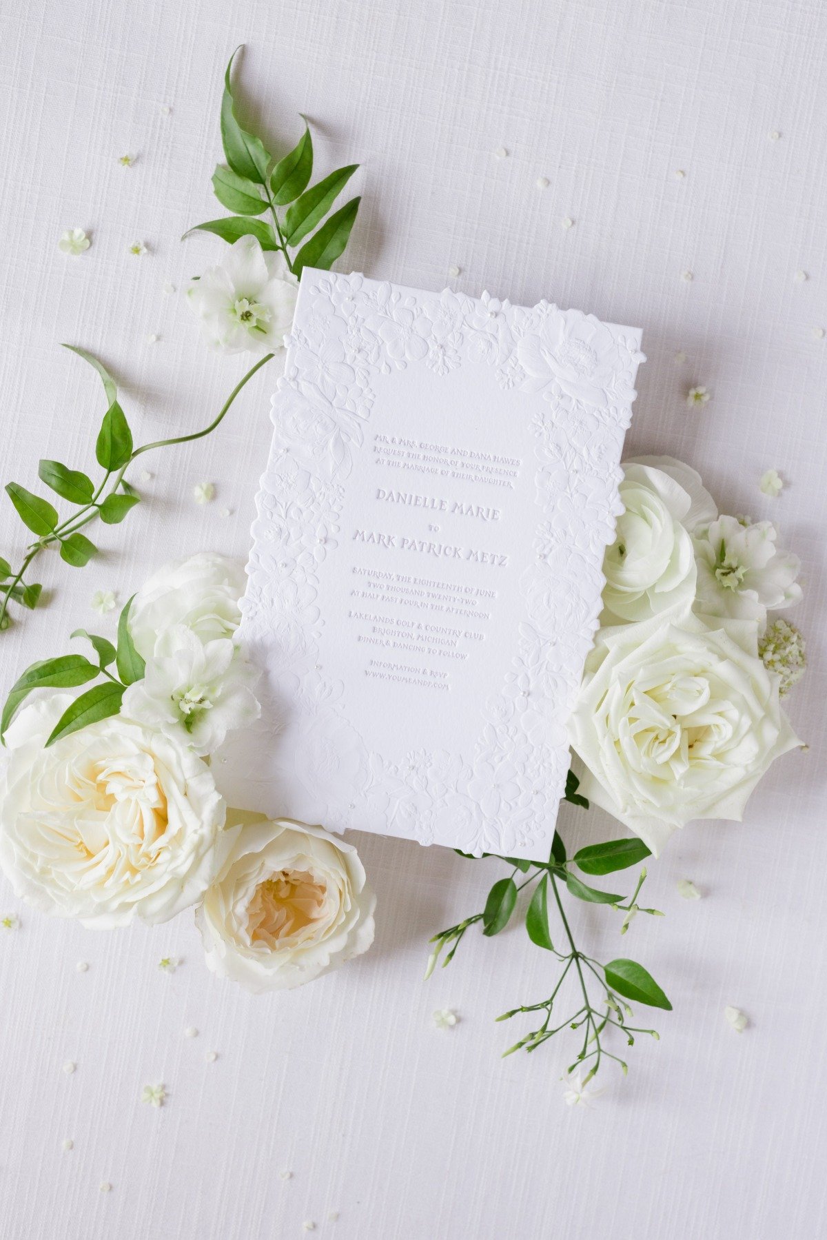 white textured wedding invitation