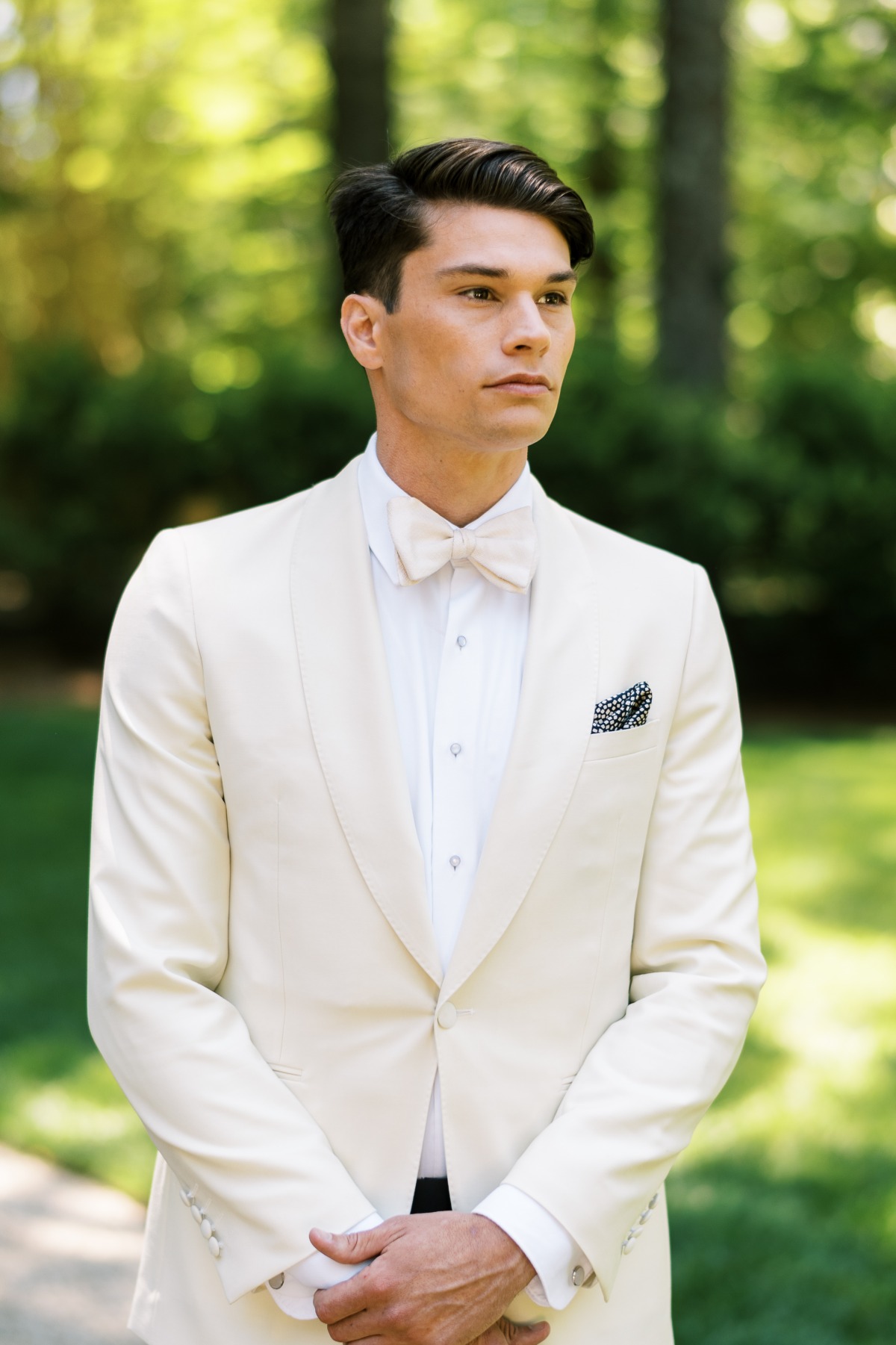 groom in ivory tuxedo