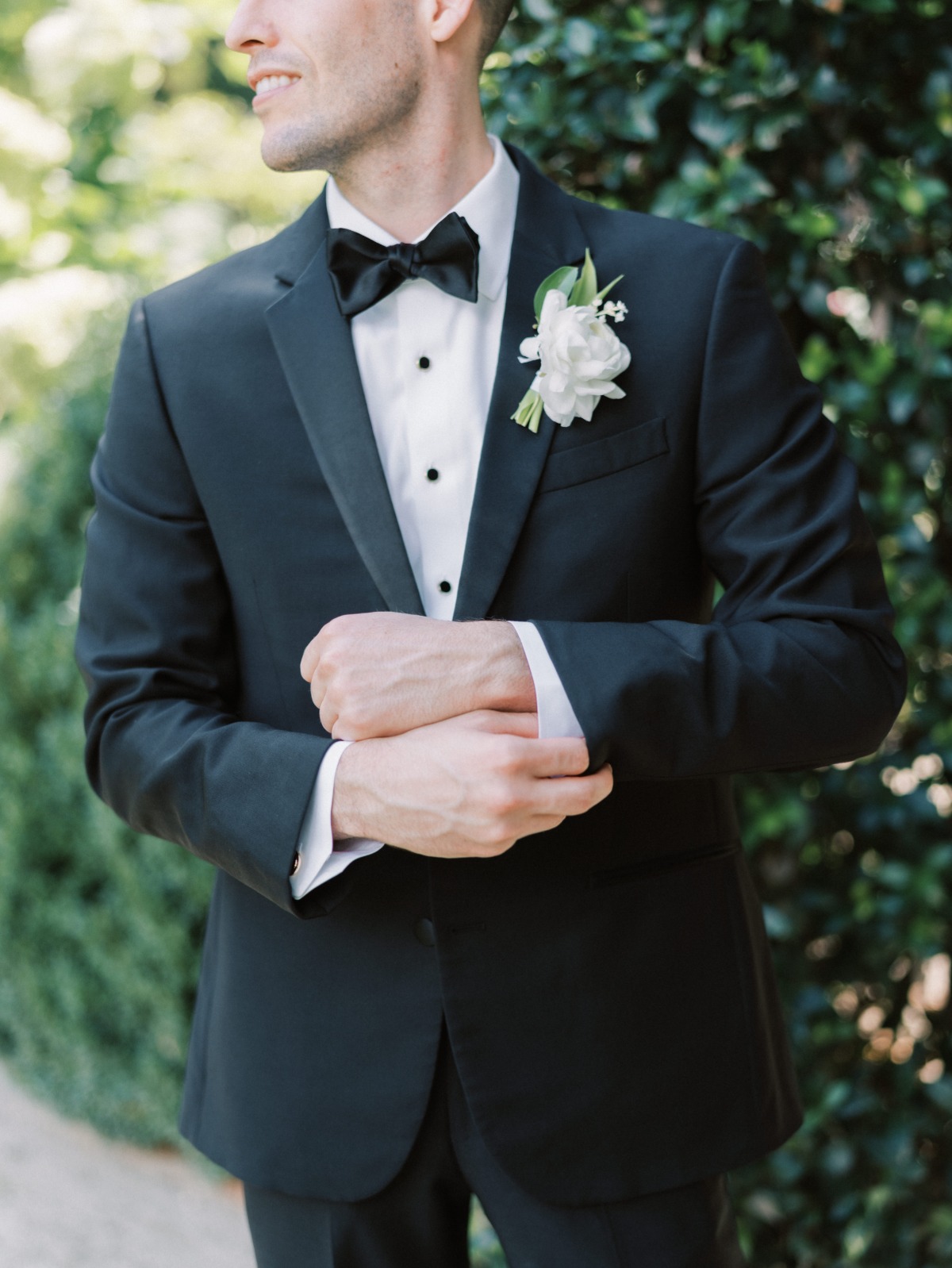 black tux with white boutonnière 