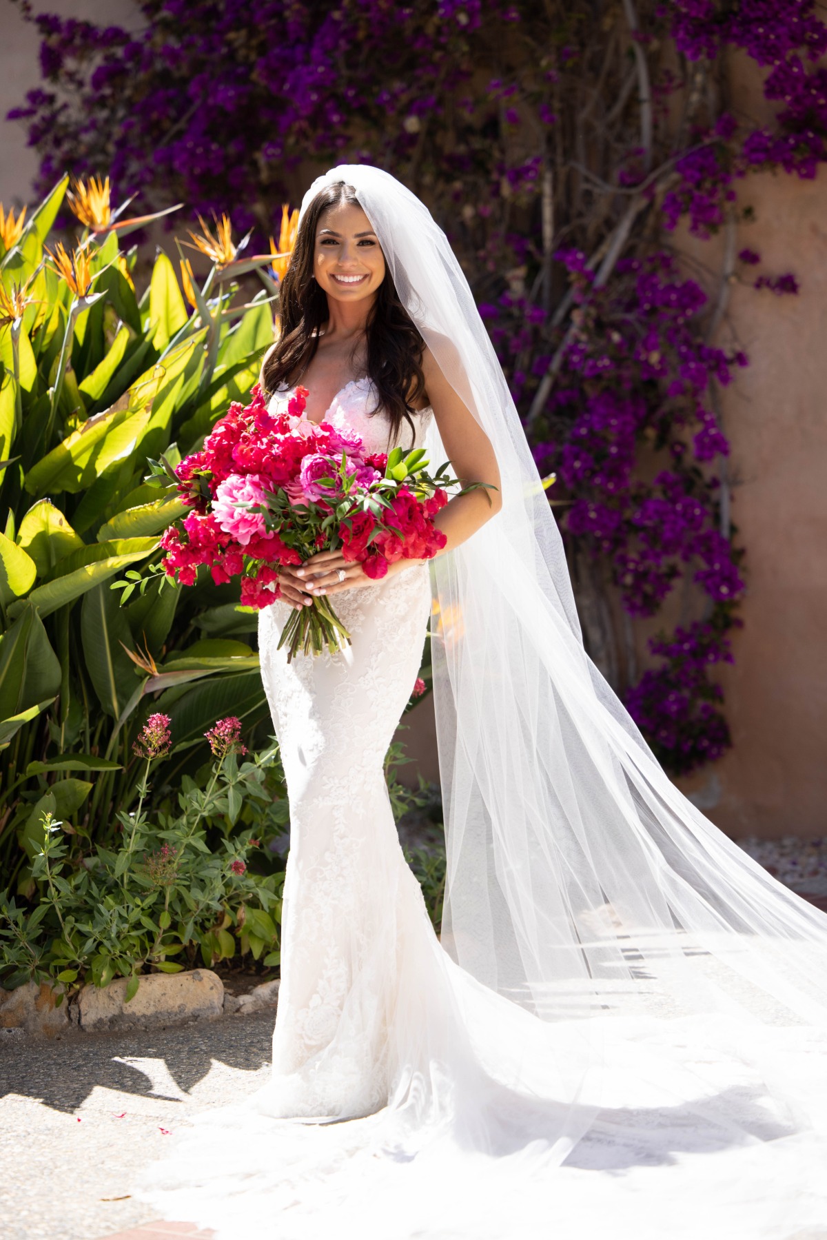 Bride with vibrant magenta bouquet