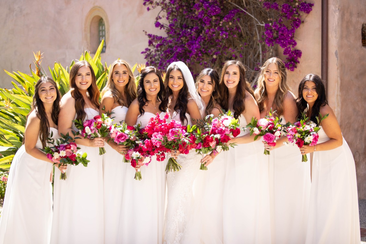 Elegant monochrome bridesmaids with pink bouquets