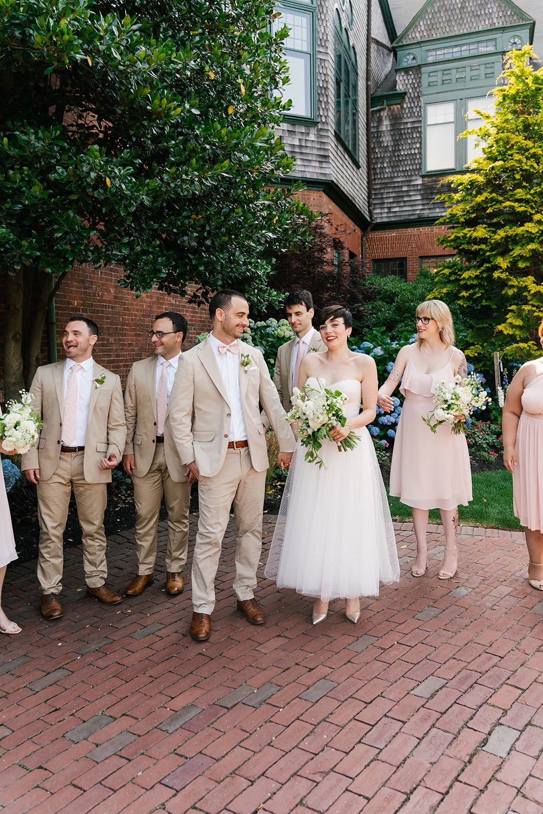 Tan and baby pink bridal party attire