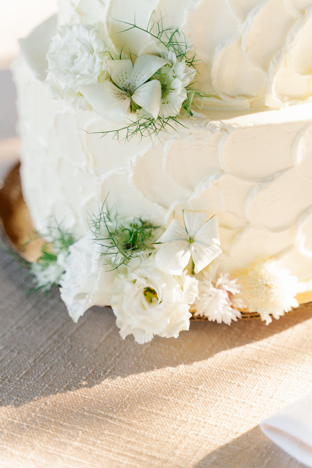 white floral details on modern wedding cake