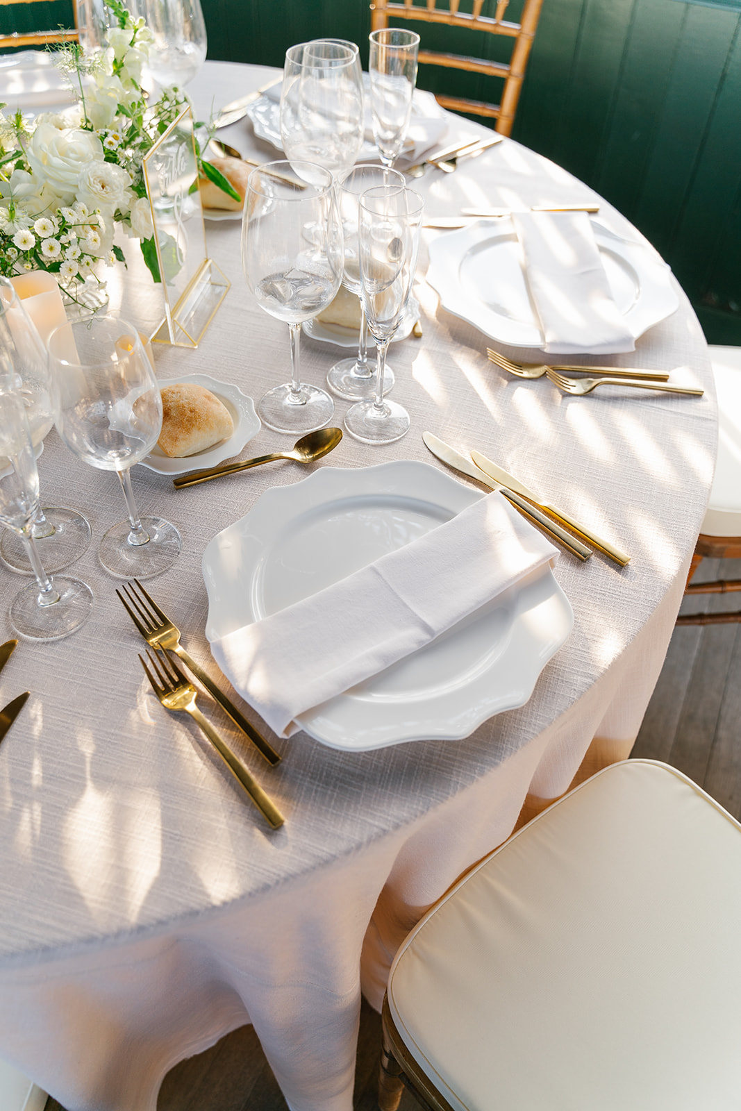 Modern gold and white wedding table setting