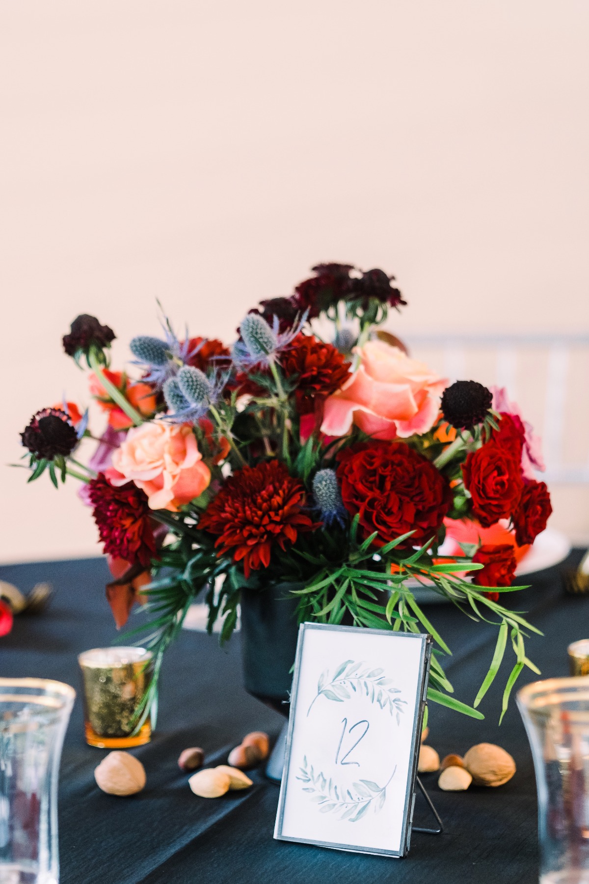 Moody dark floral arrangements for reception