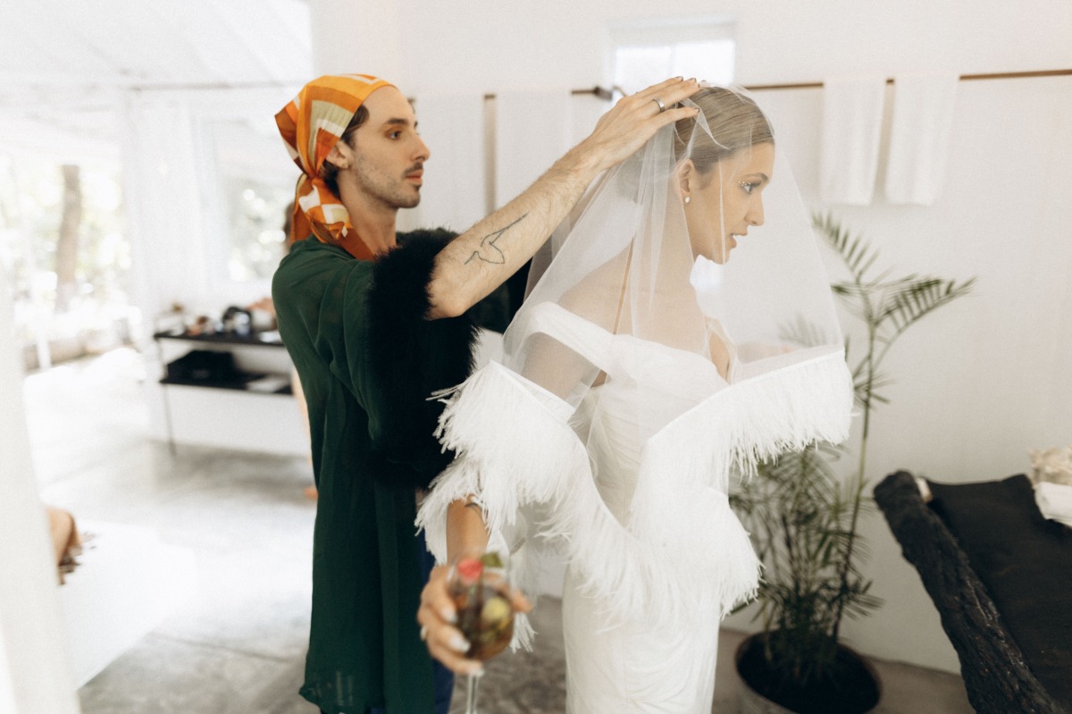 Bride having custom veil placed