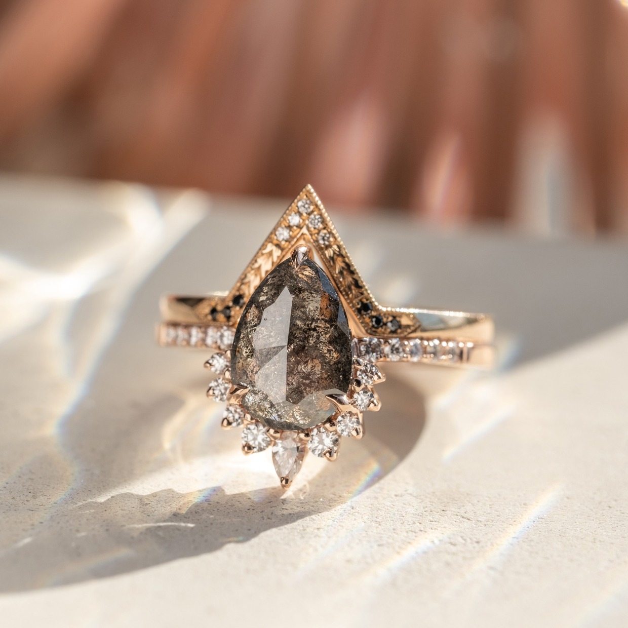 beautiful pear shaped salt and pepper engagement ring by Point No Point Studio
