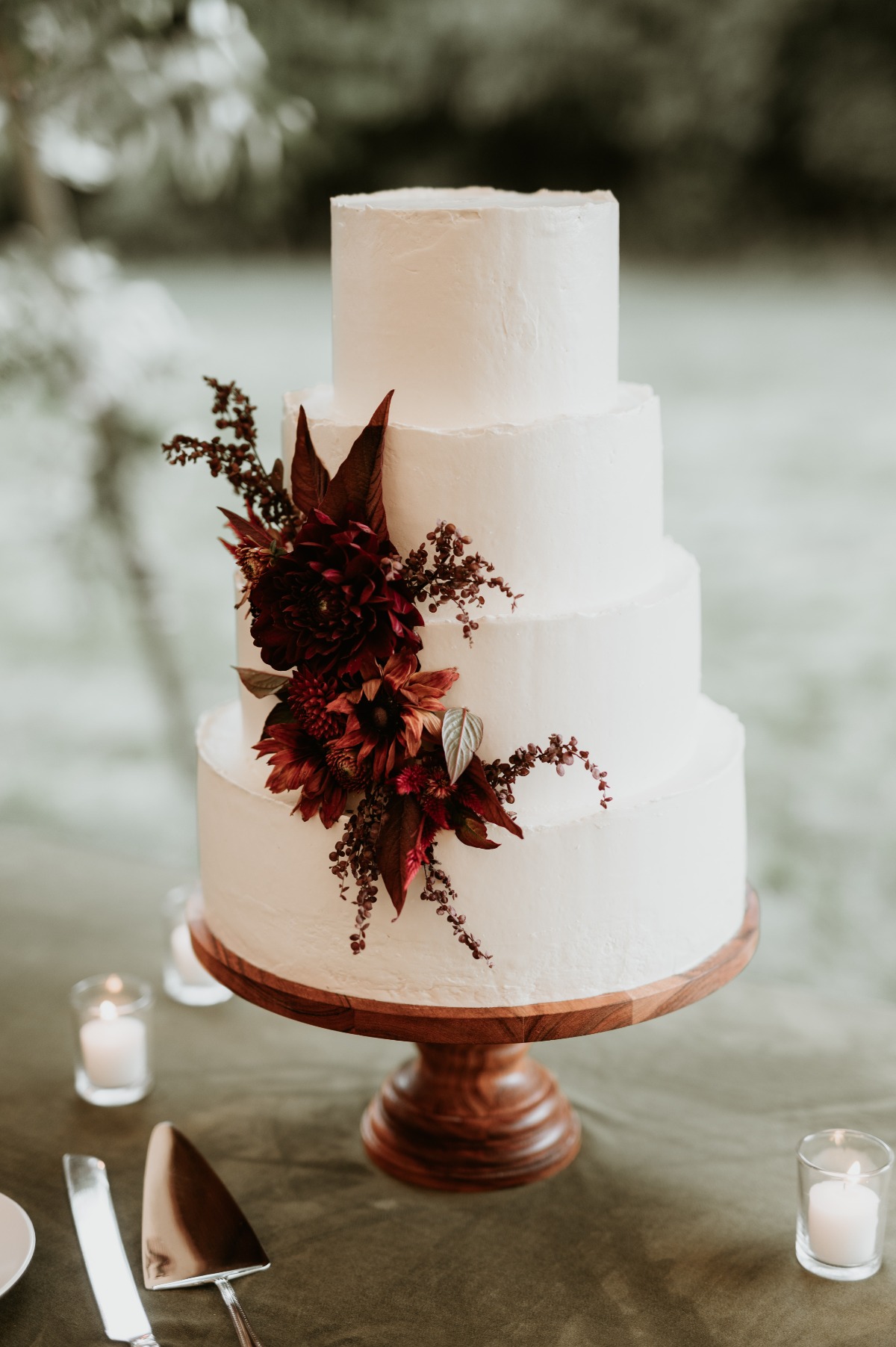 Simple wedding cake with jewel tone florals 