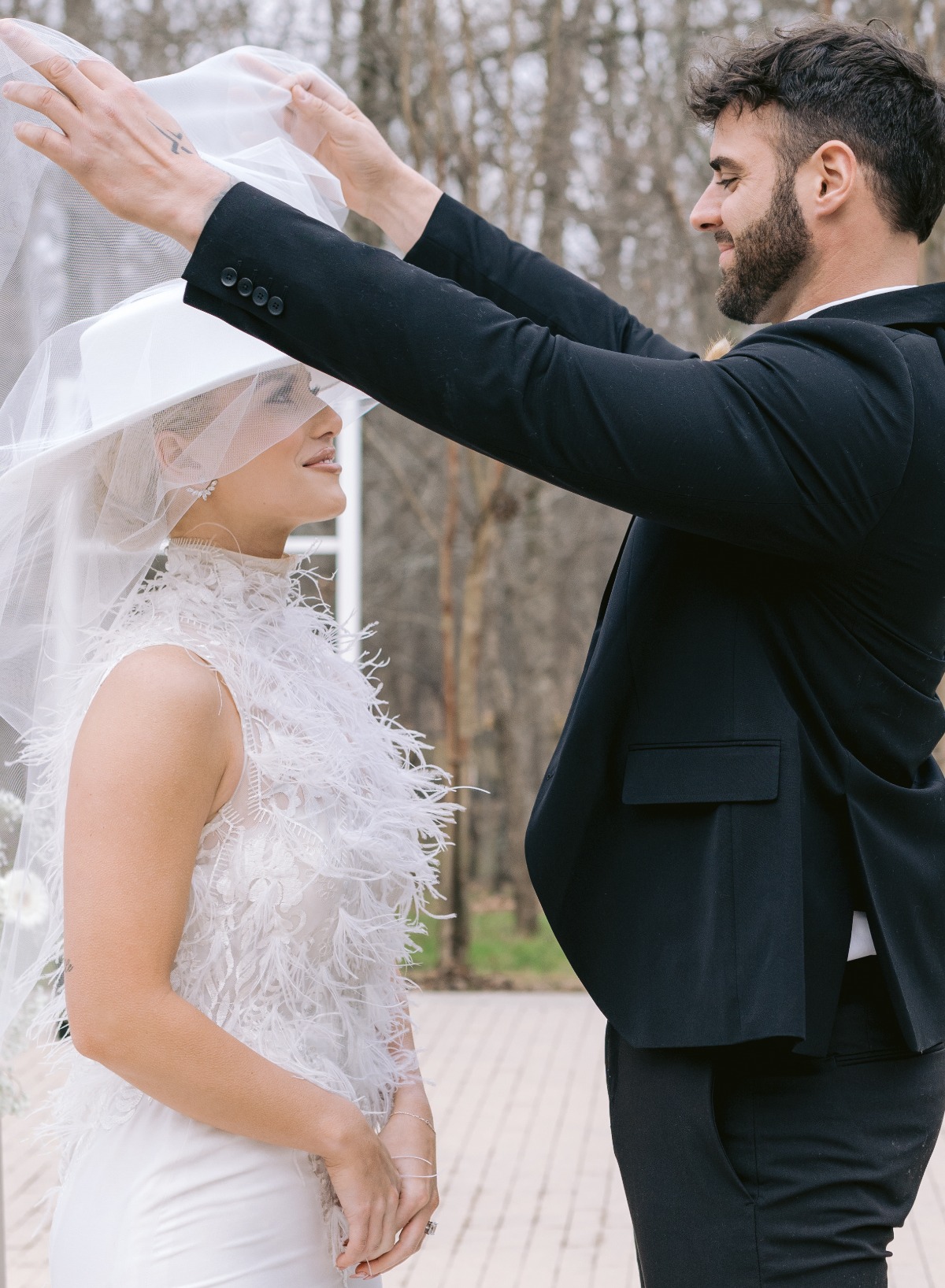 Groom lifting veil for first look 