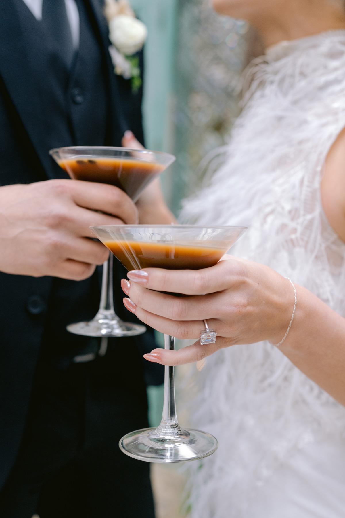 Newlyweds cheering espresso martinis 