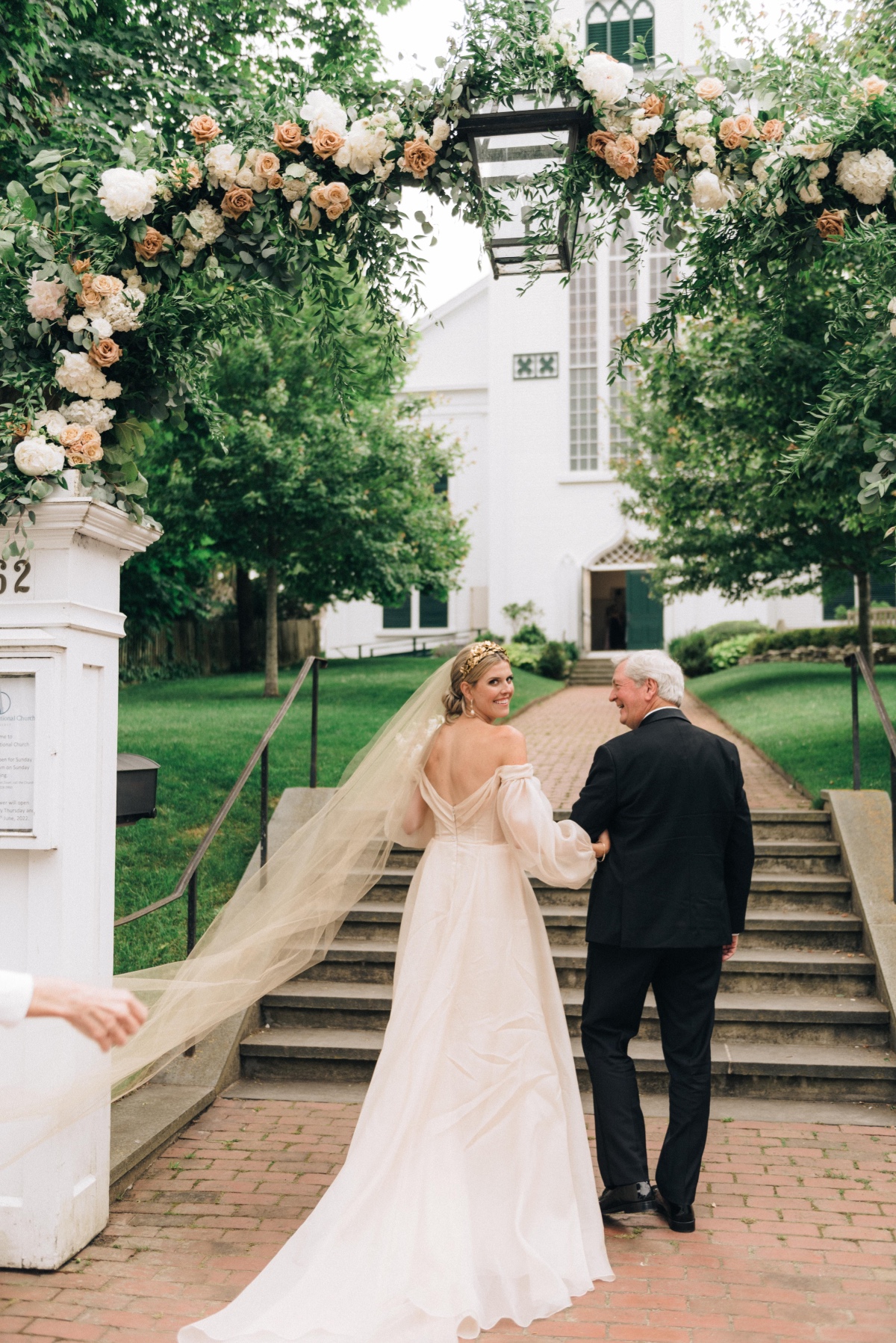 Father walking bride to chapel 