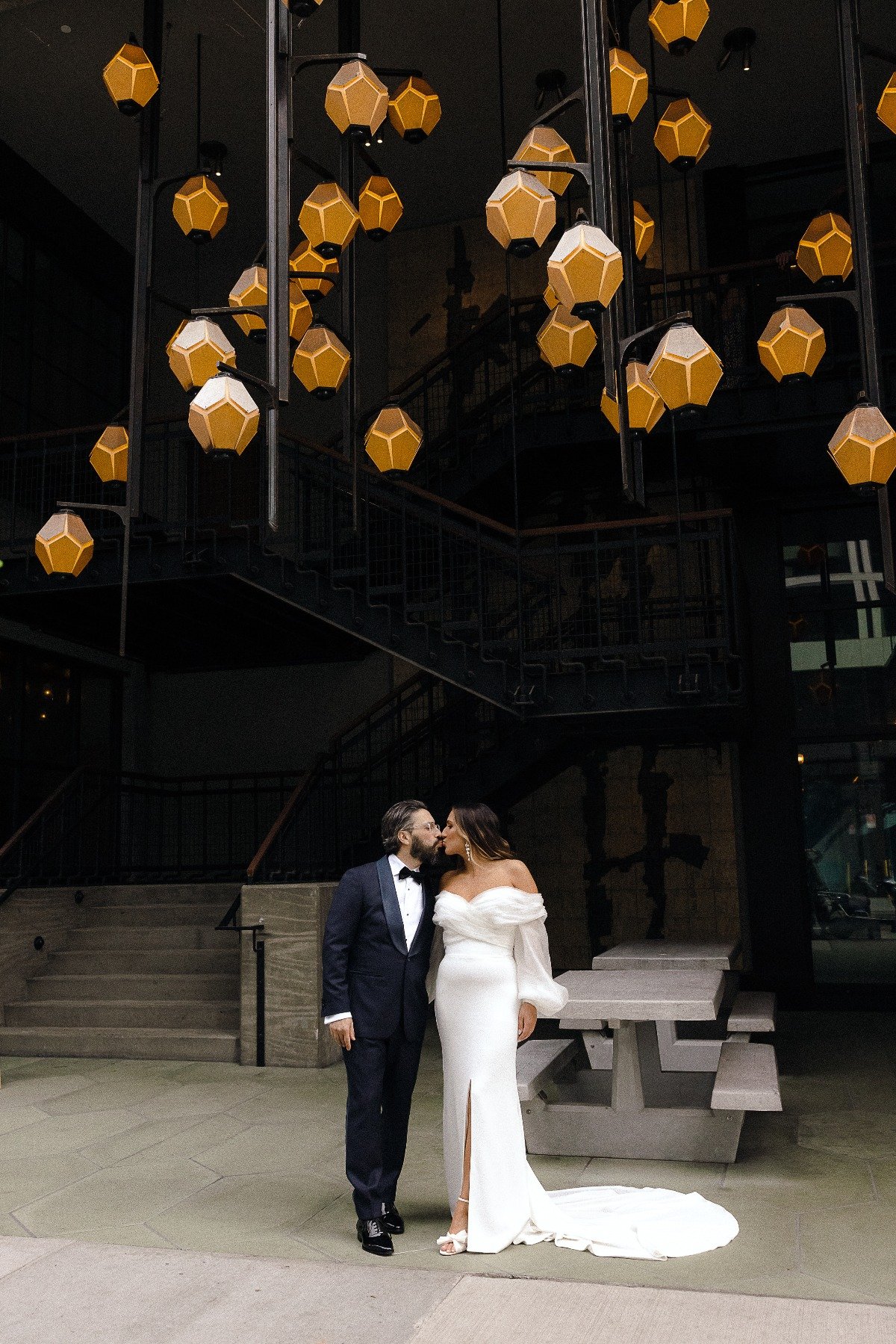 Modern bride and groom kiss at Ace Hotel