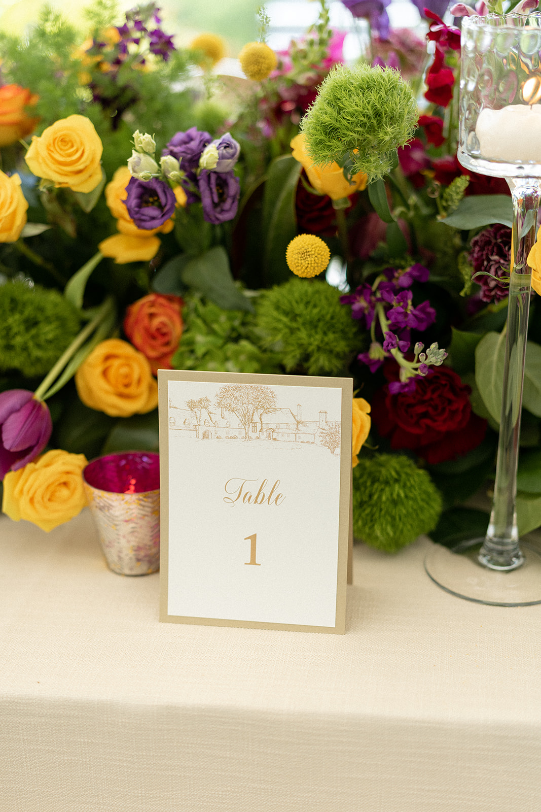 white and gold table numbers