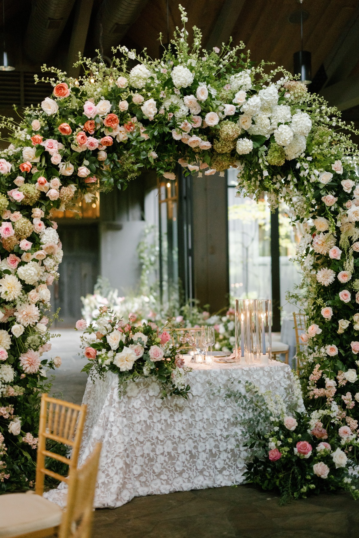 Floral arch for garden sweetheart table 