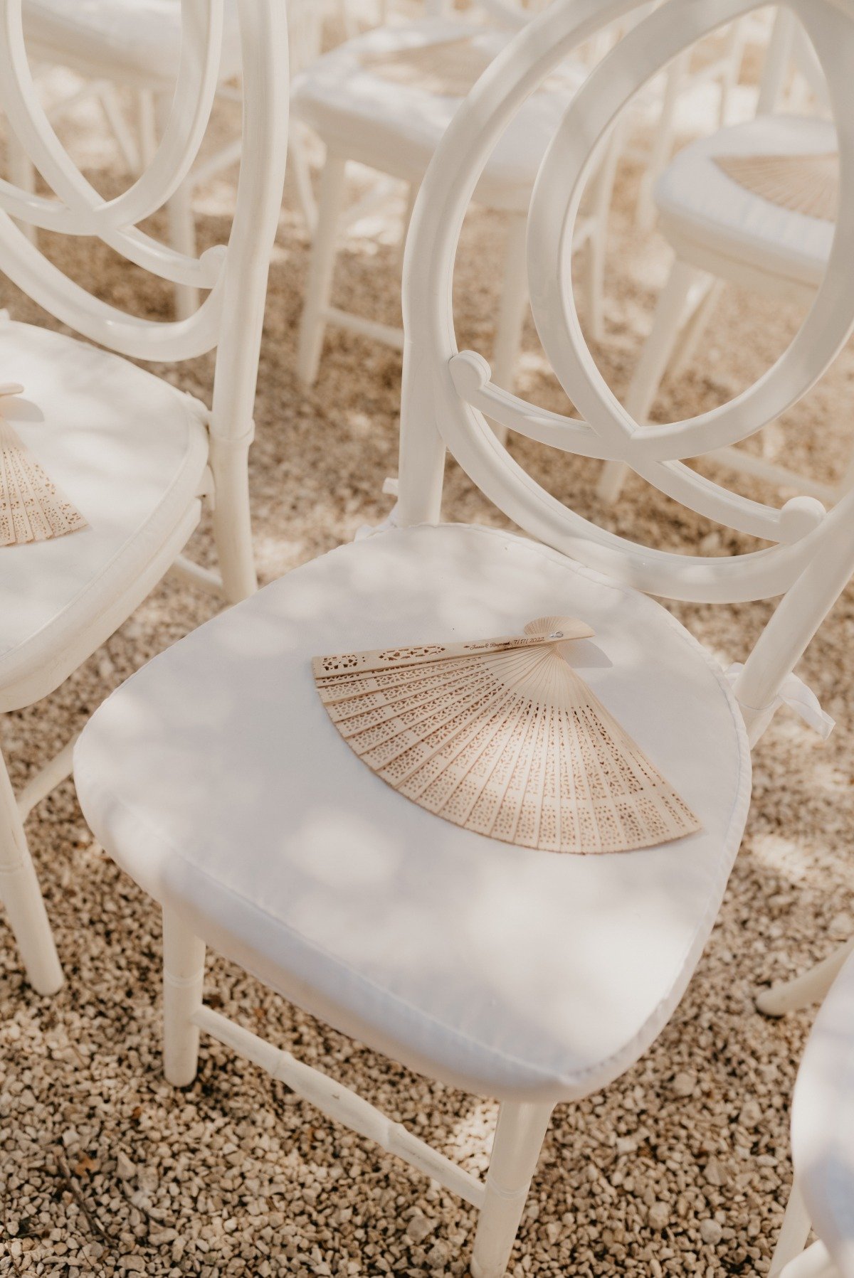 Chic wedding seats with wood fan