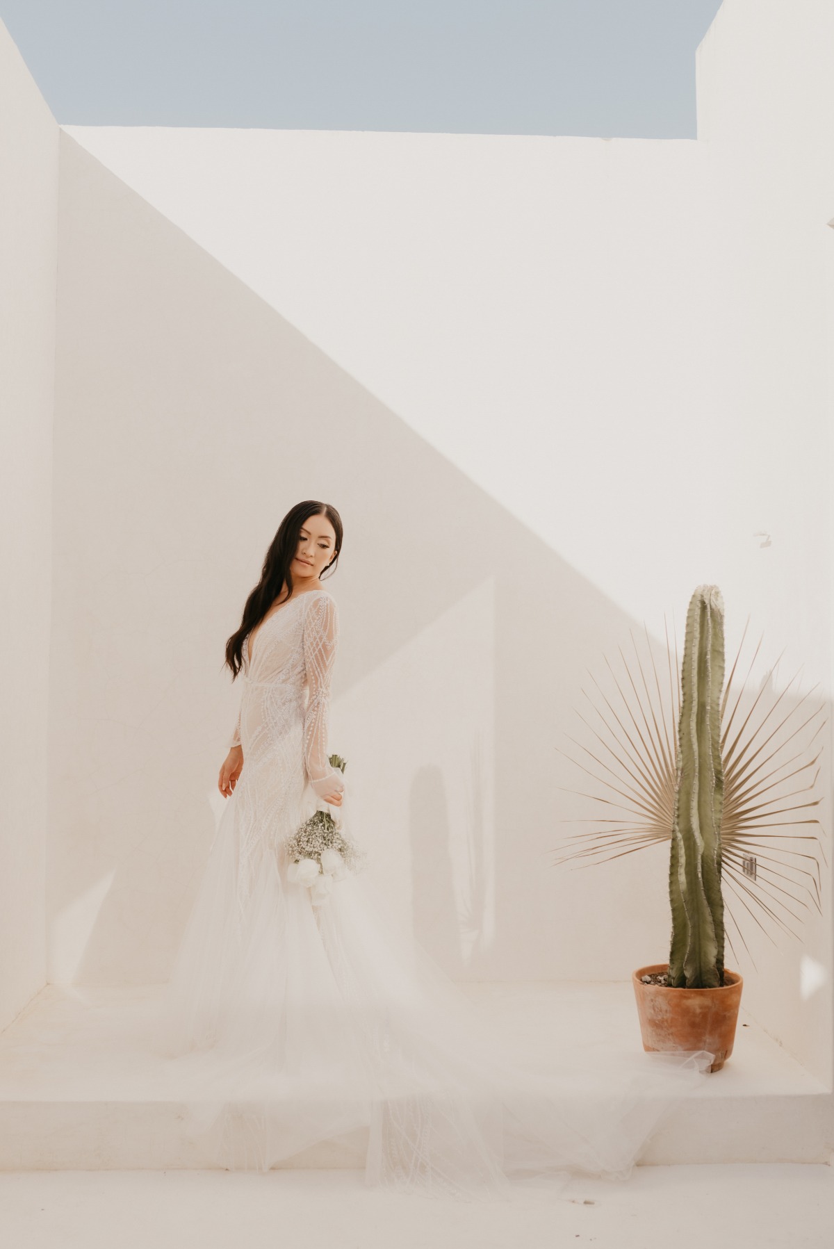 Elegant modern Tulum bride with cactus