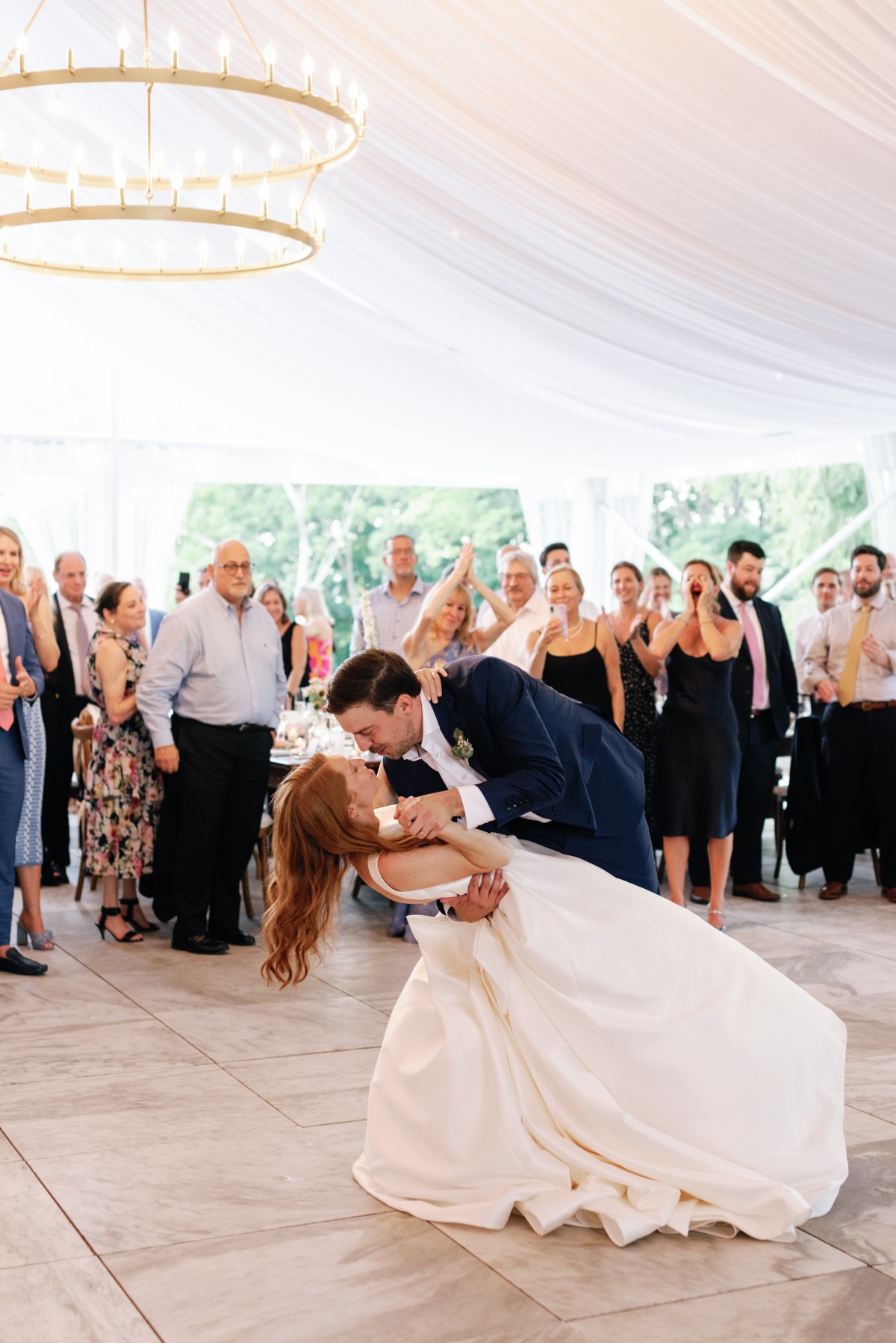 Bride and groom first dance at tented reception 