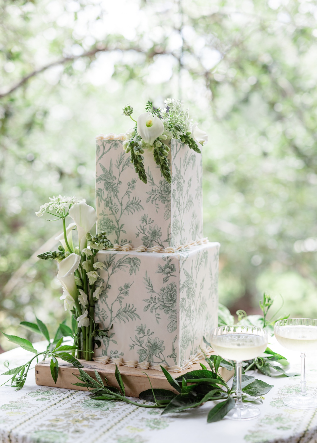 Green toile patterned wedding cake 