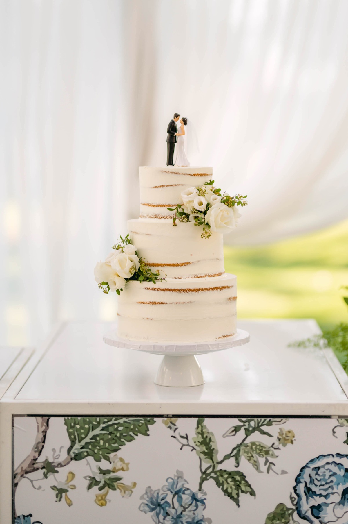 Naked cake on floral cake stand 
