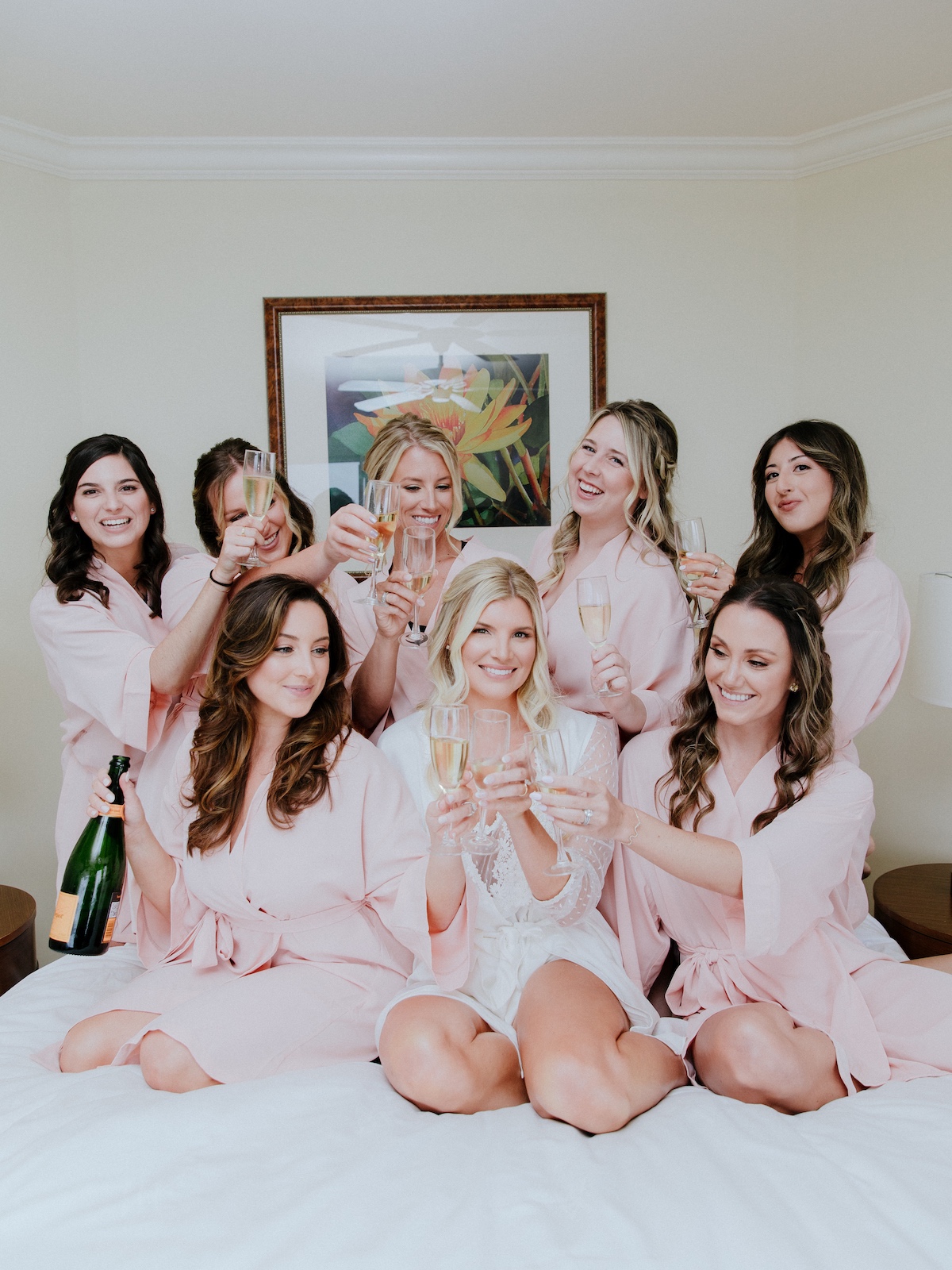 Bride and bridesmaids in pink robes 