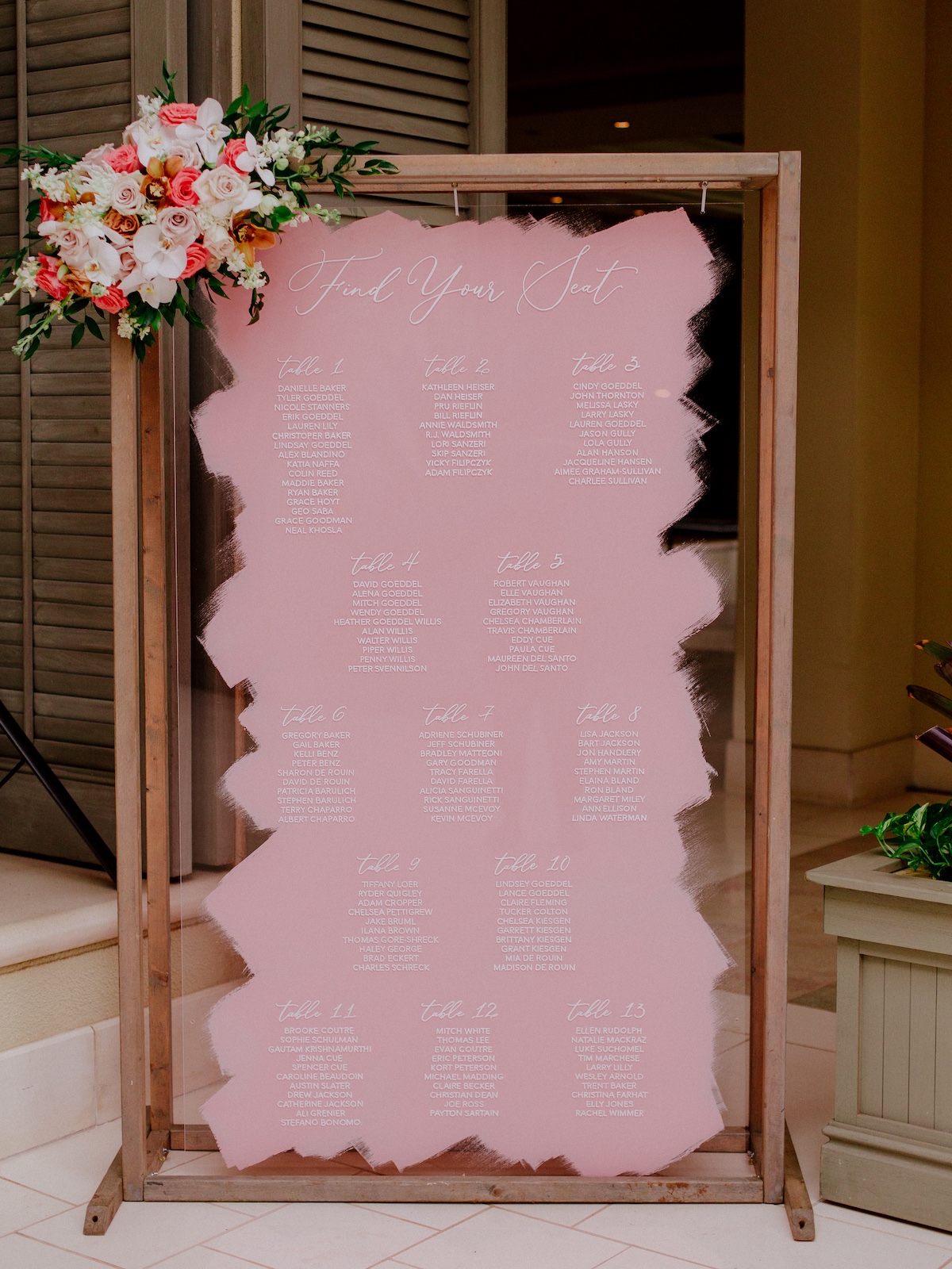 Pink painted wedding seating chart 