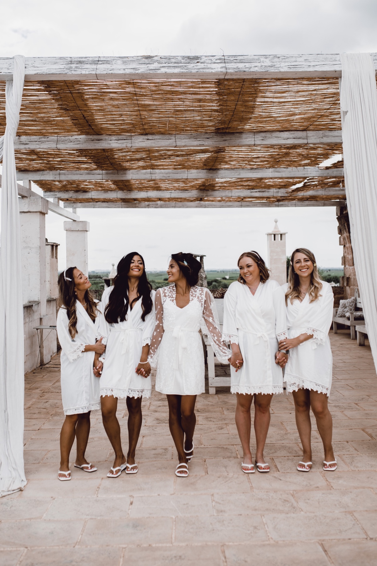 Matching white bridesmaids robes 