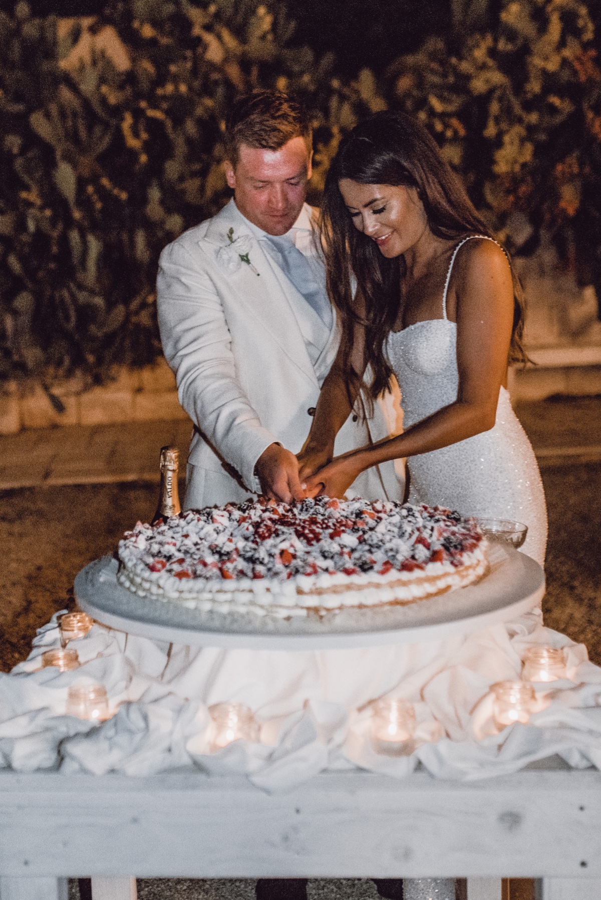 Bride and groom cutting millefoglie cake 