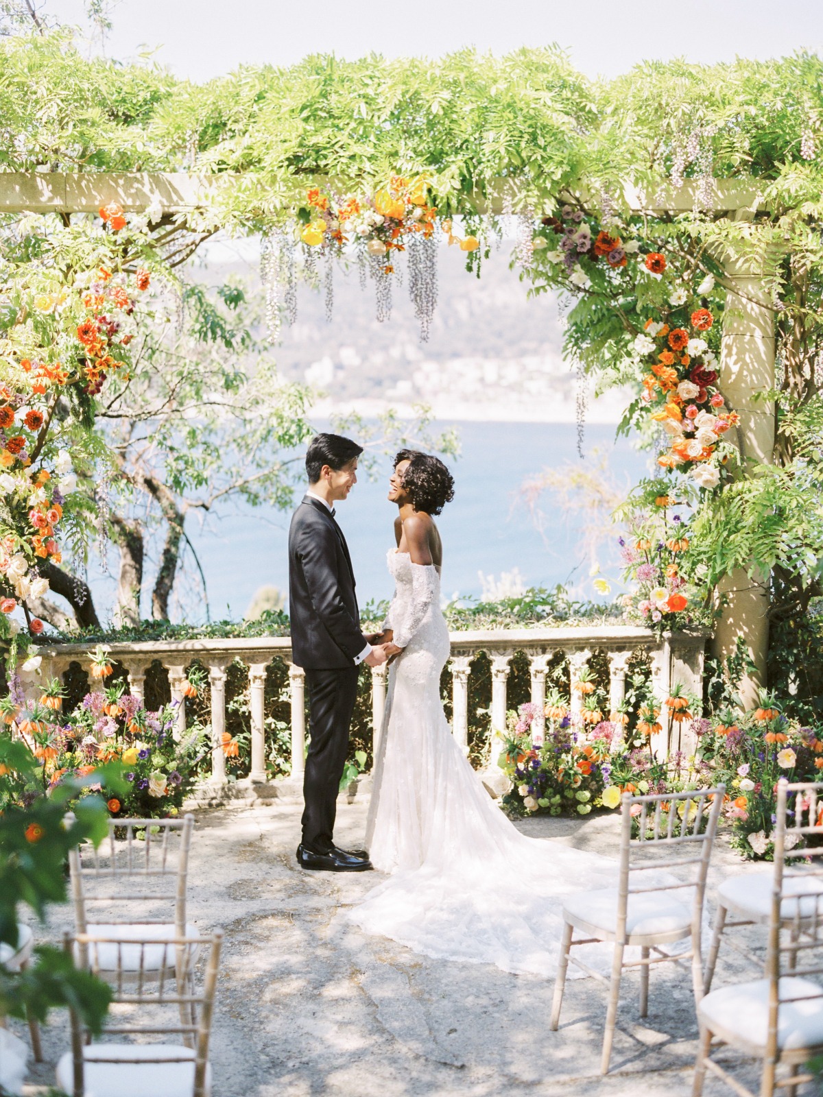 Seaside colorful floral wedding ceremony 