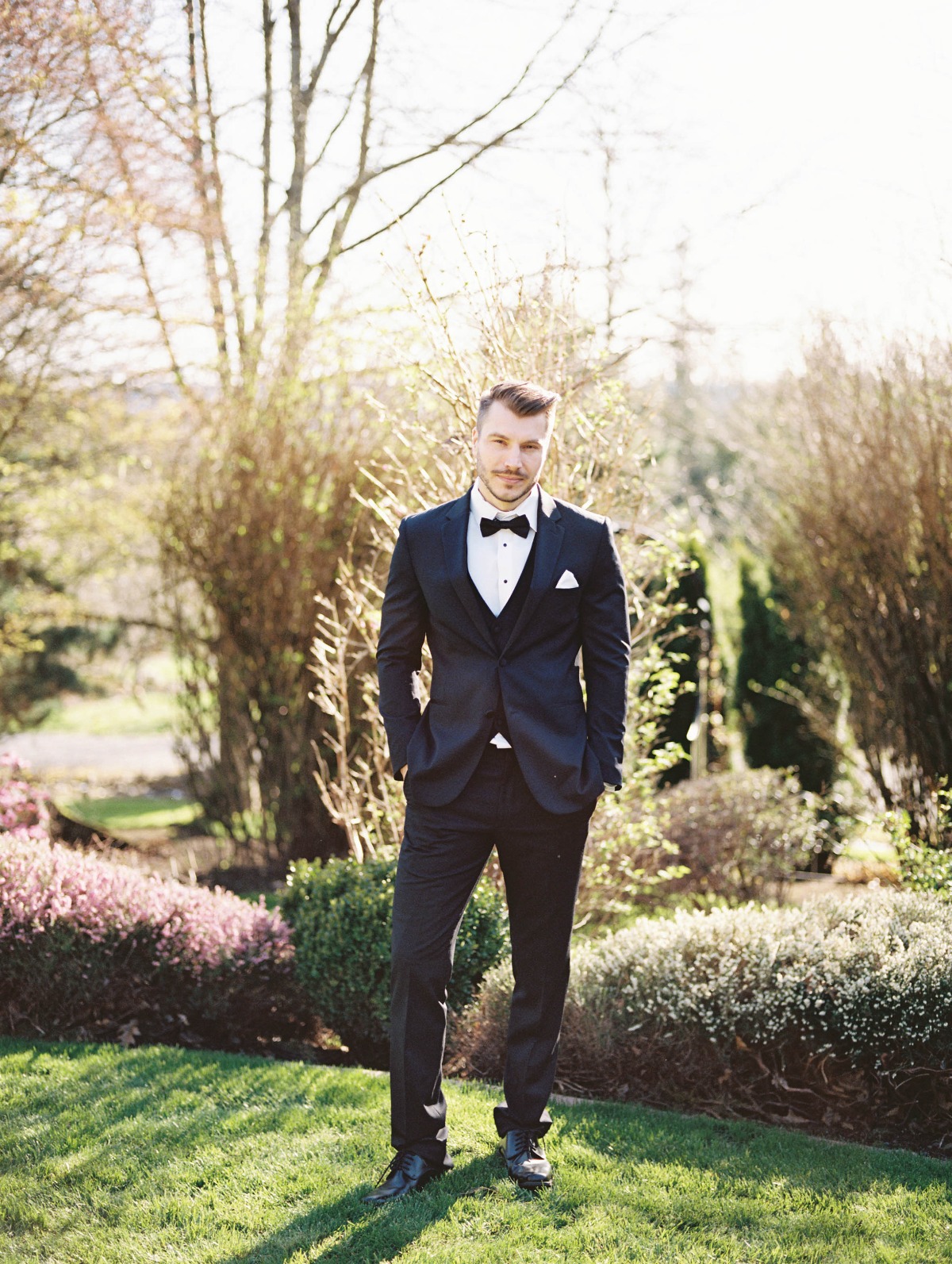 Groom in fitted tuxedo
