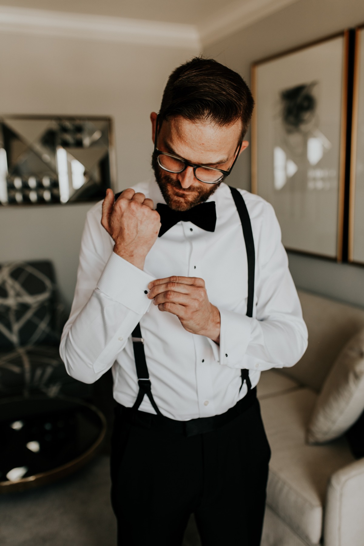 Classic groom in bowtie and suspenders 