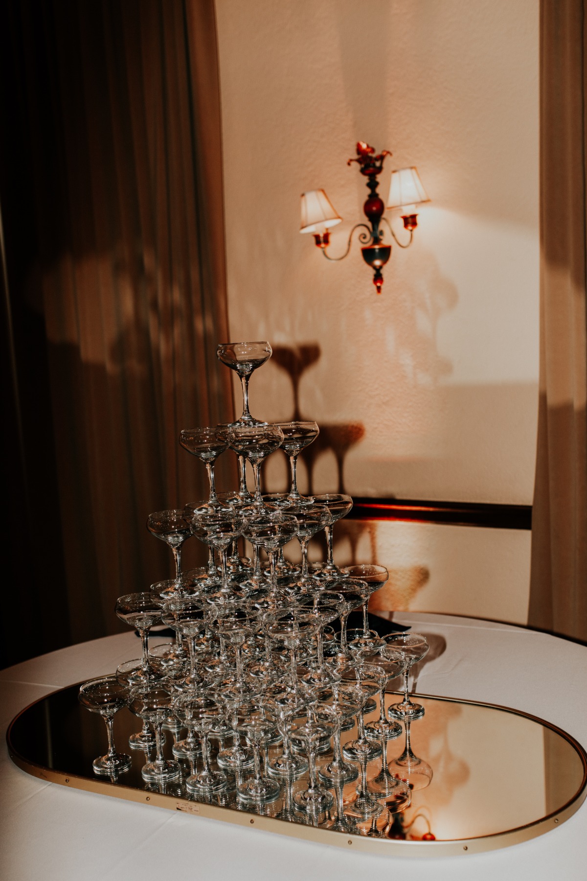 Classic champagne tower on mirror