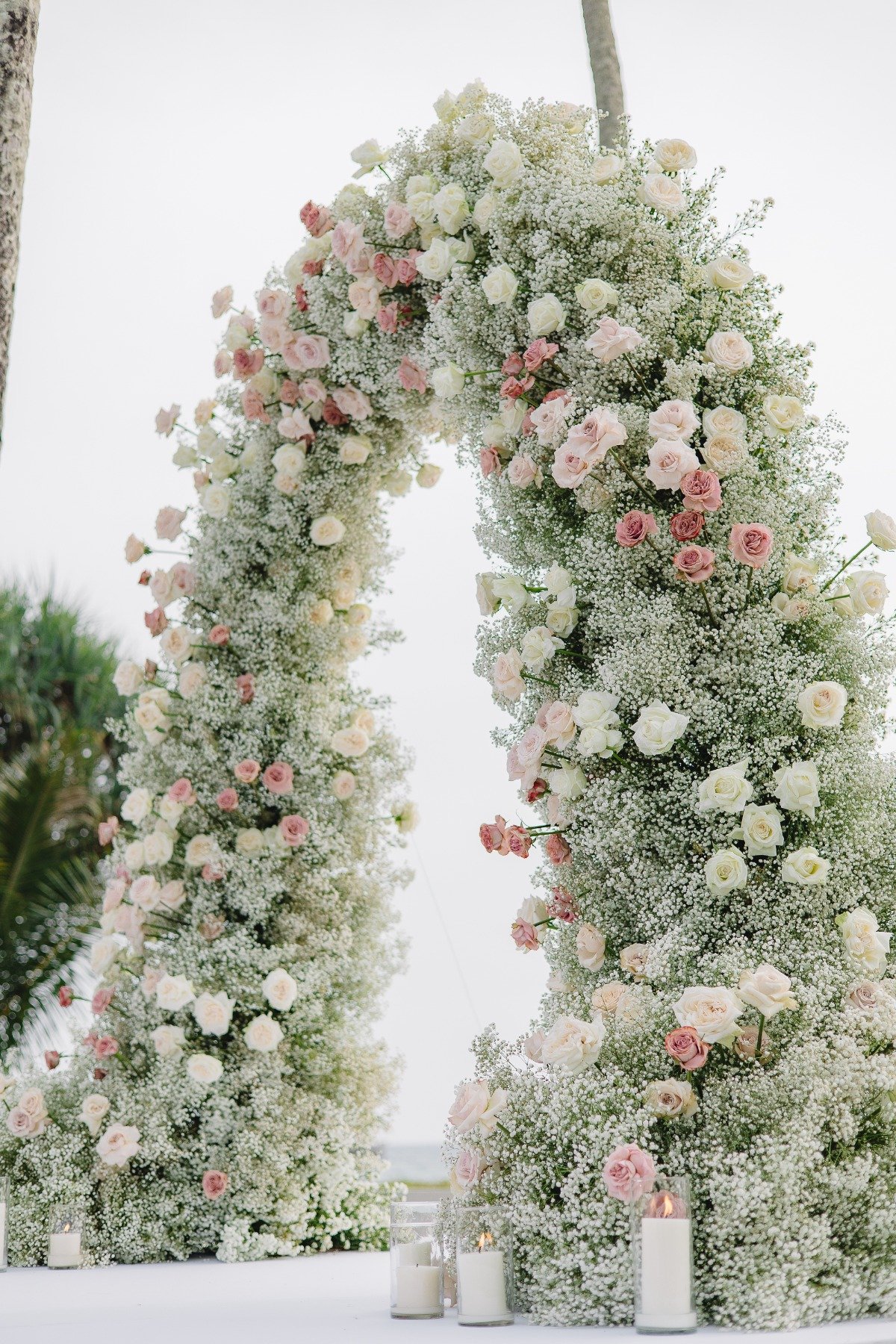 dusty pink rose and baby's breath floral arch