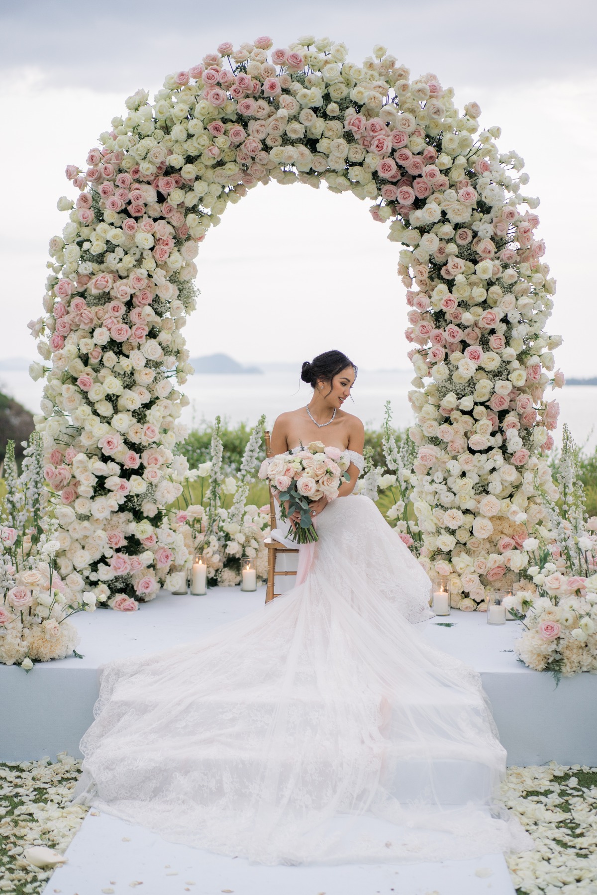 Elegant bride with rose arch 
