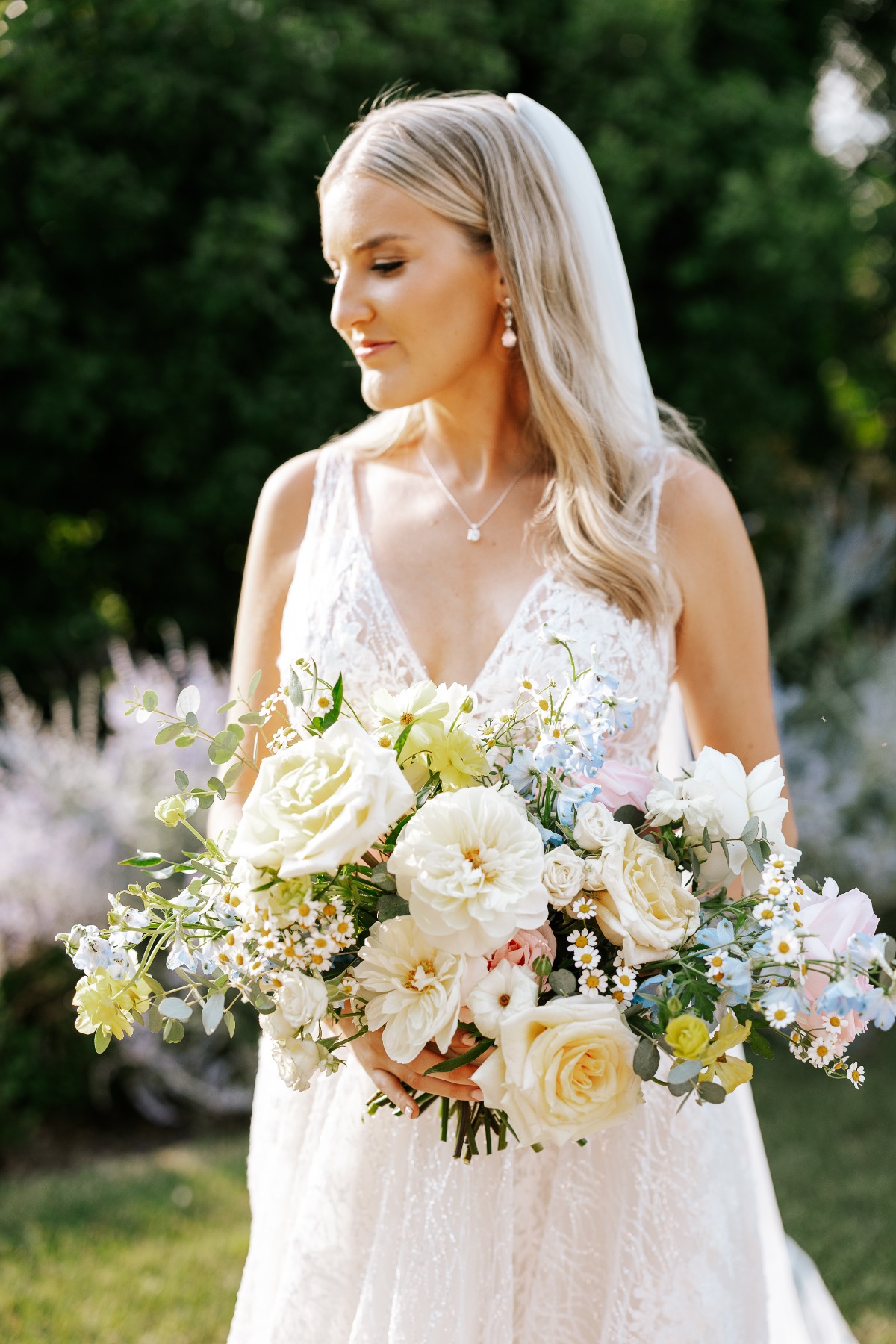 Bride with luscious spring bouquet 