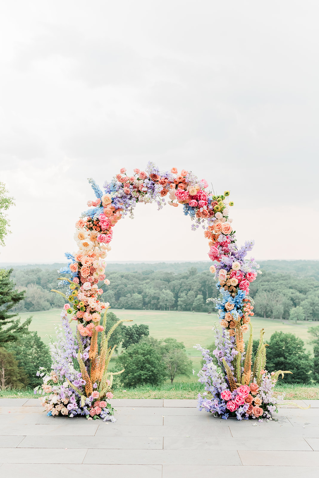 muted rainbow floral arch